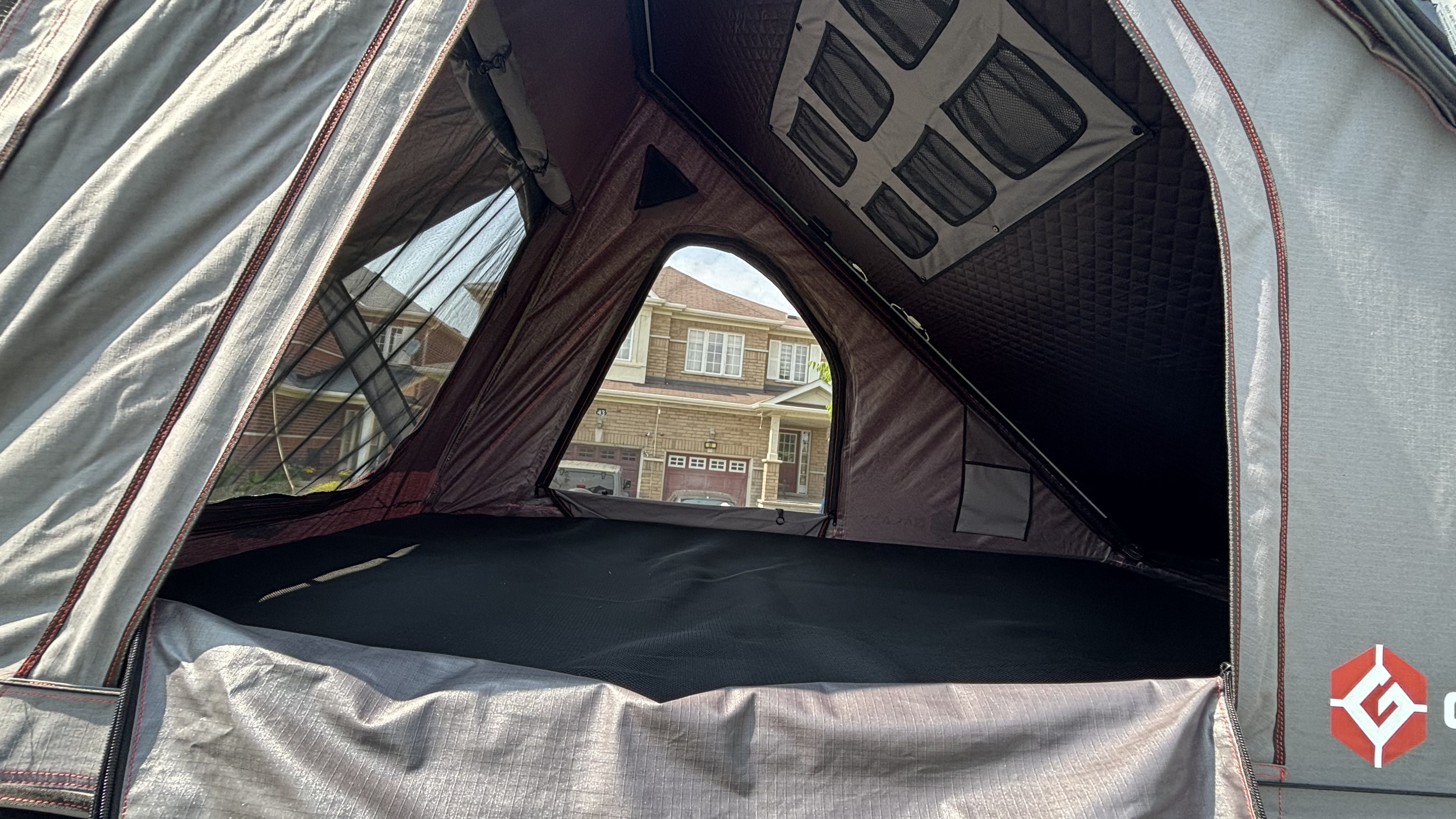 View from inside a cozy rooftop tent setup. Perfect for an **rv rental** trip or backyard glamping.. Ford Ford F150 2025