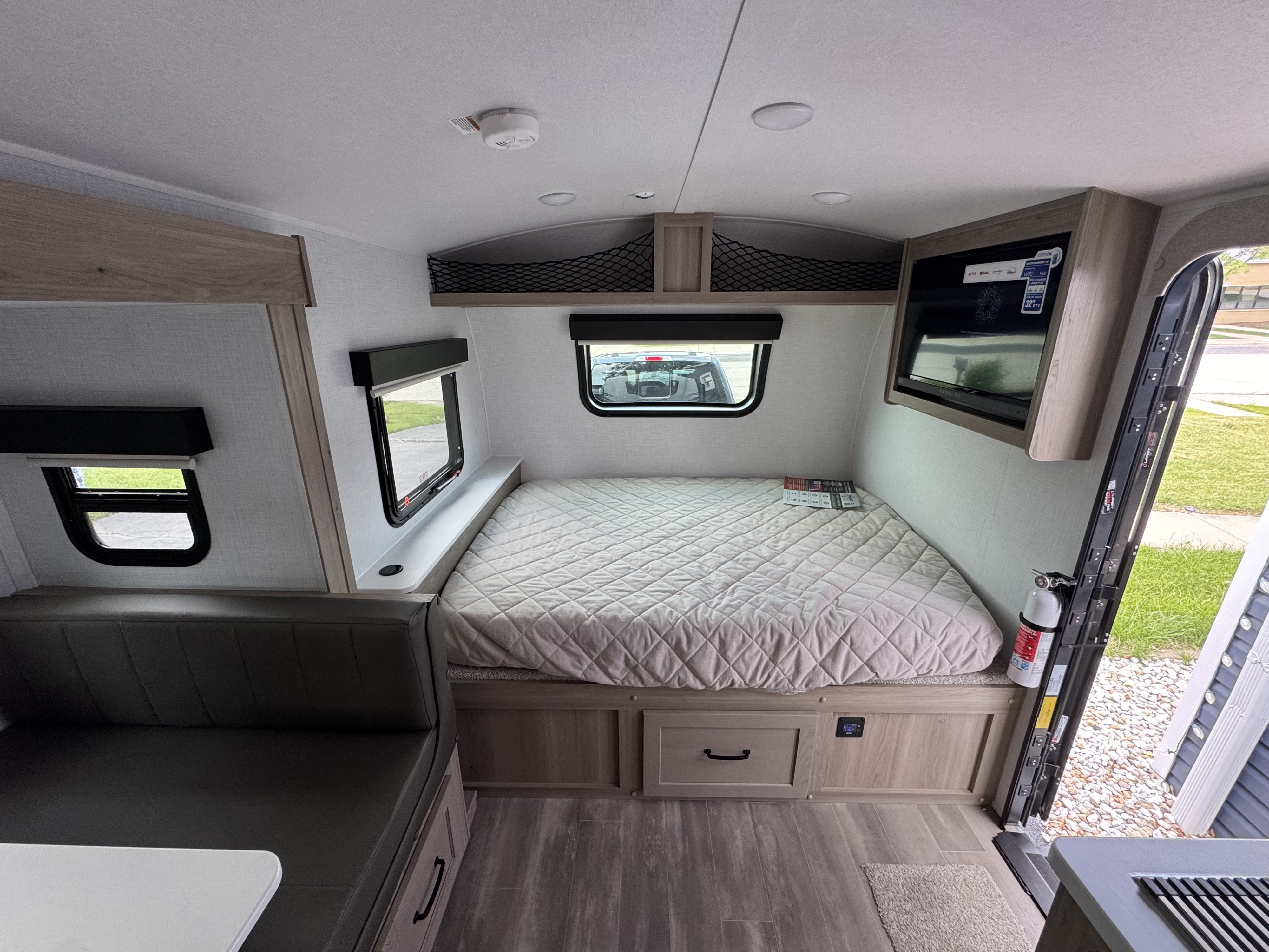 Cozy RV rental interior featuring a comfortable bed, dinette, and ample storage, perfect for your next adventure.. Forest River Flagstaff E-Pro 20BHS 2025