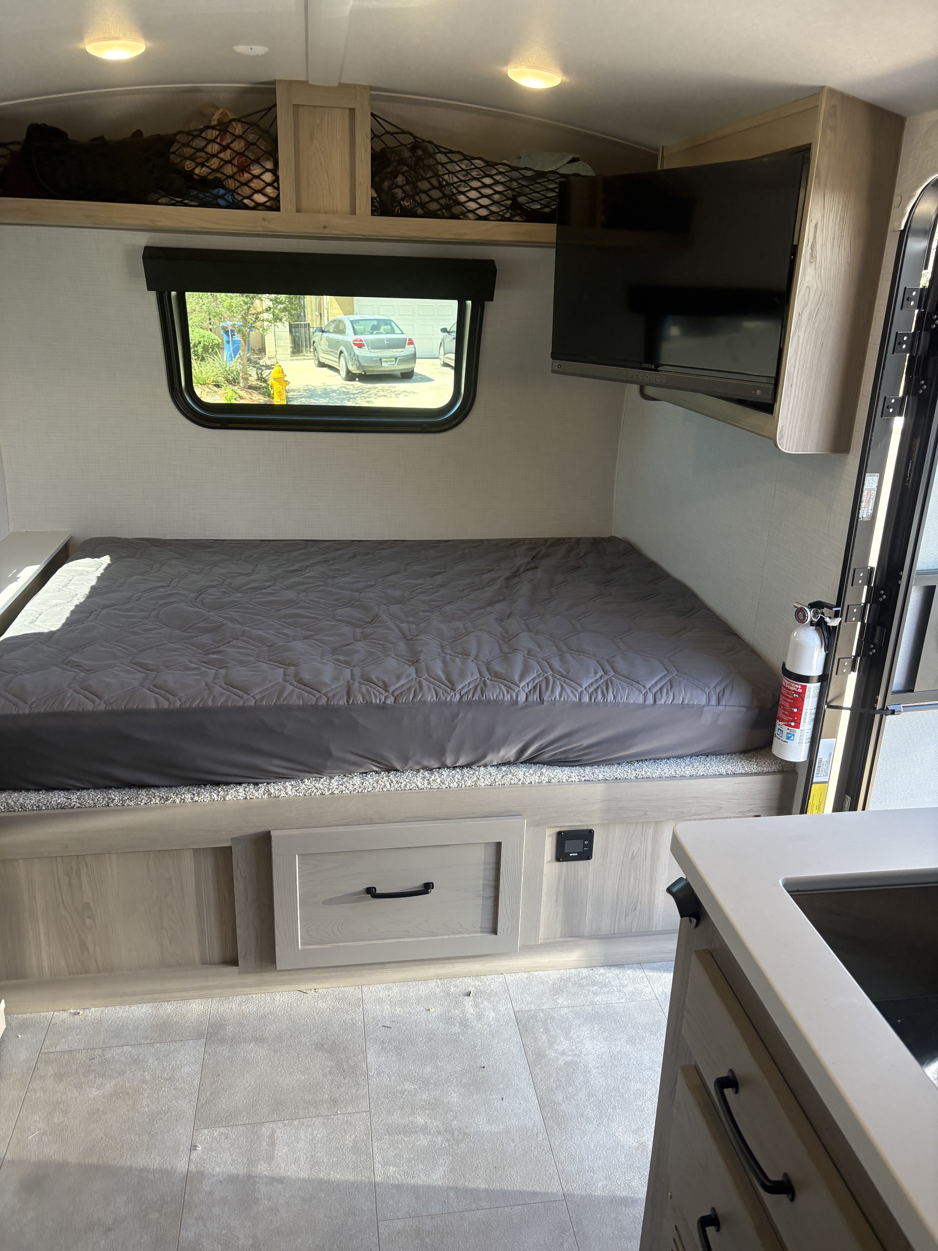 This RV rental offers a cozy bedroom: comfy bed, overhead net storage, TV, and under-bed drawers.. FlagStaff E-PRO 20BH 2025