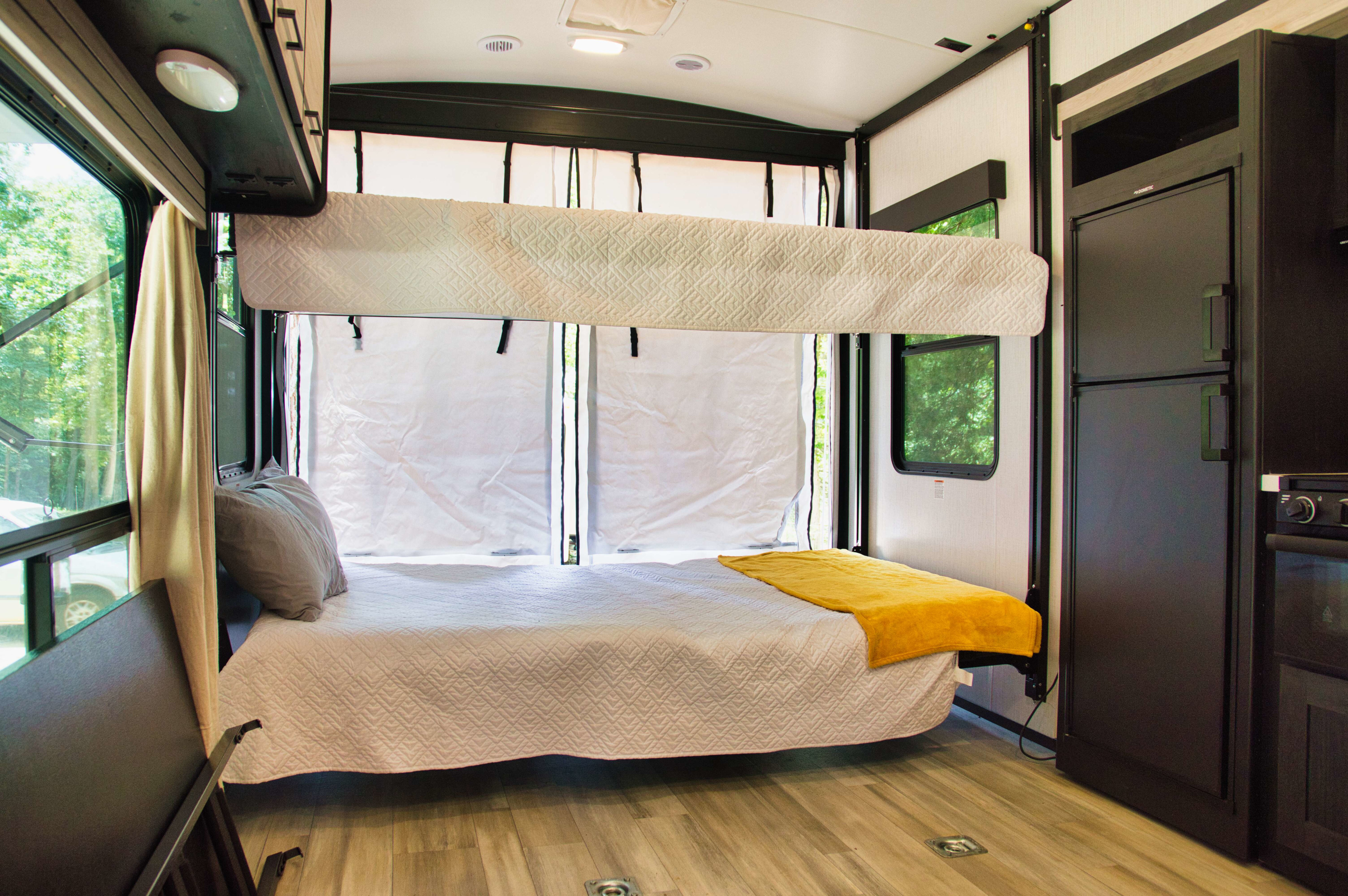 Spacious RV rental interior with comfy bunk beds and kitchen, ideal for your next mobile adventure.. Cruiser Stryker 2022