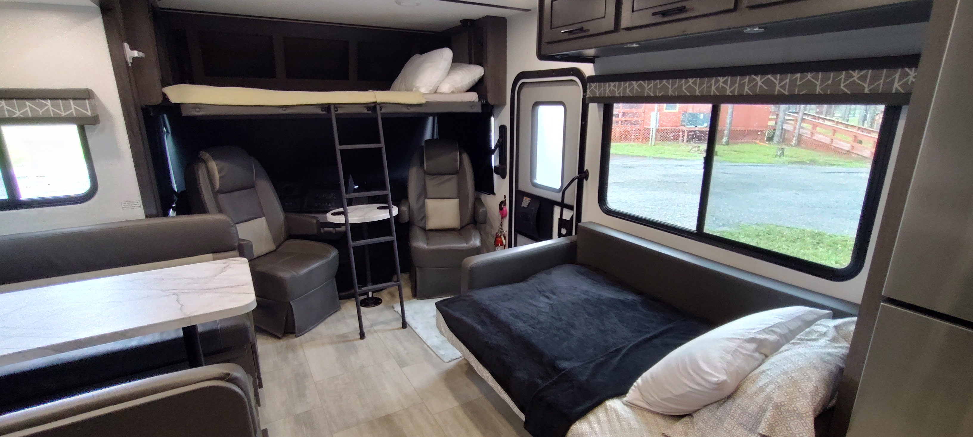 Explore this RV rental's versatile interior: bunk beds, dining area, and a comfortable convertible sofa. Ready for adventure!. FR3 FR3 Motorhome 2024