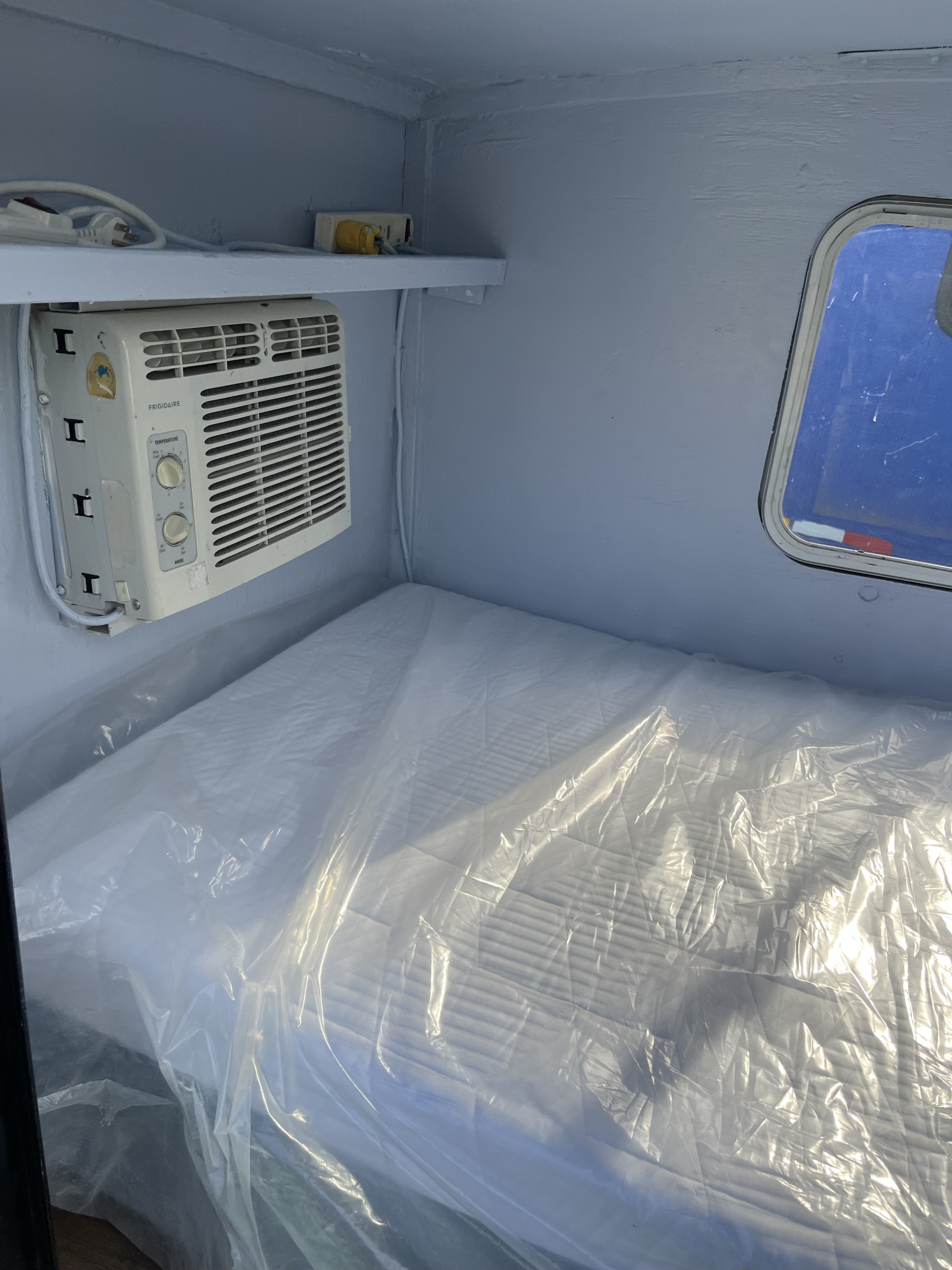 Get comfortable in our RV rental! This cozy sleeping space features AC, a power strip, and a fresh mattress.. Dutchmen AERO 400 2012