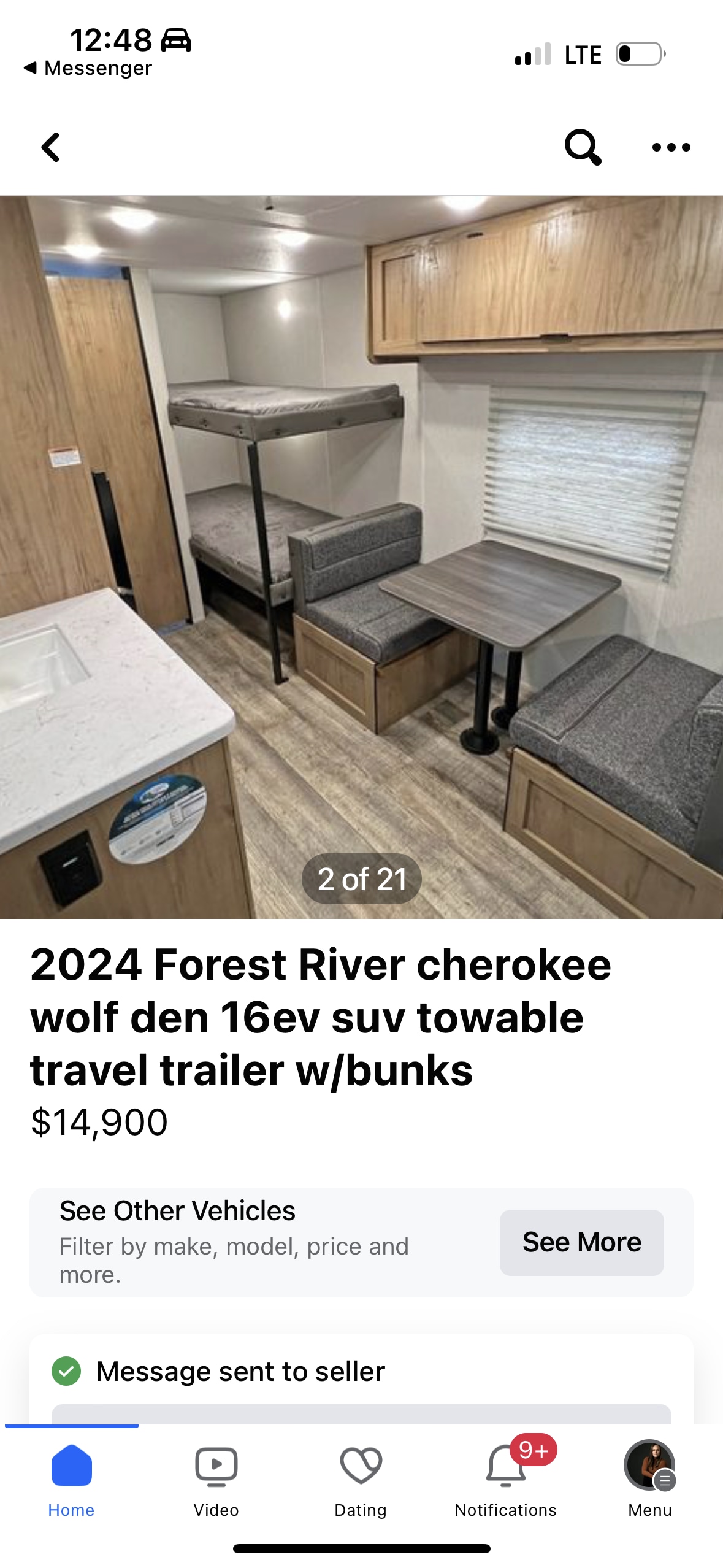 Interior of a 2024 Forest River travel trailer, ready for RV rental. Features bunks, dinette, and kitchenette.. Forest River Wolf Den 2024