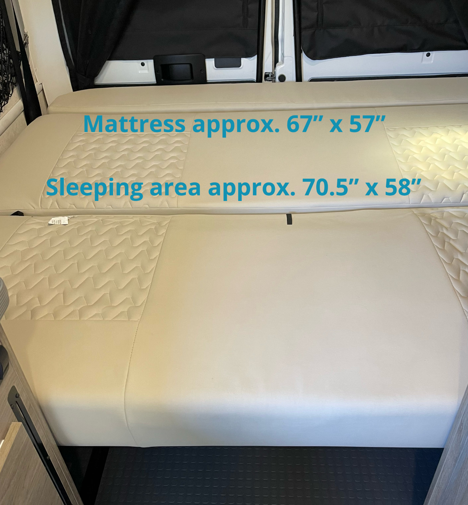 RV rental interior bed with mattress (67"x57") & sleeping area (70.5"x58") dimensions, showing convertible comfort.. Winnebago Solis 2021