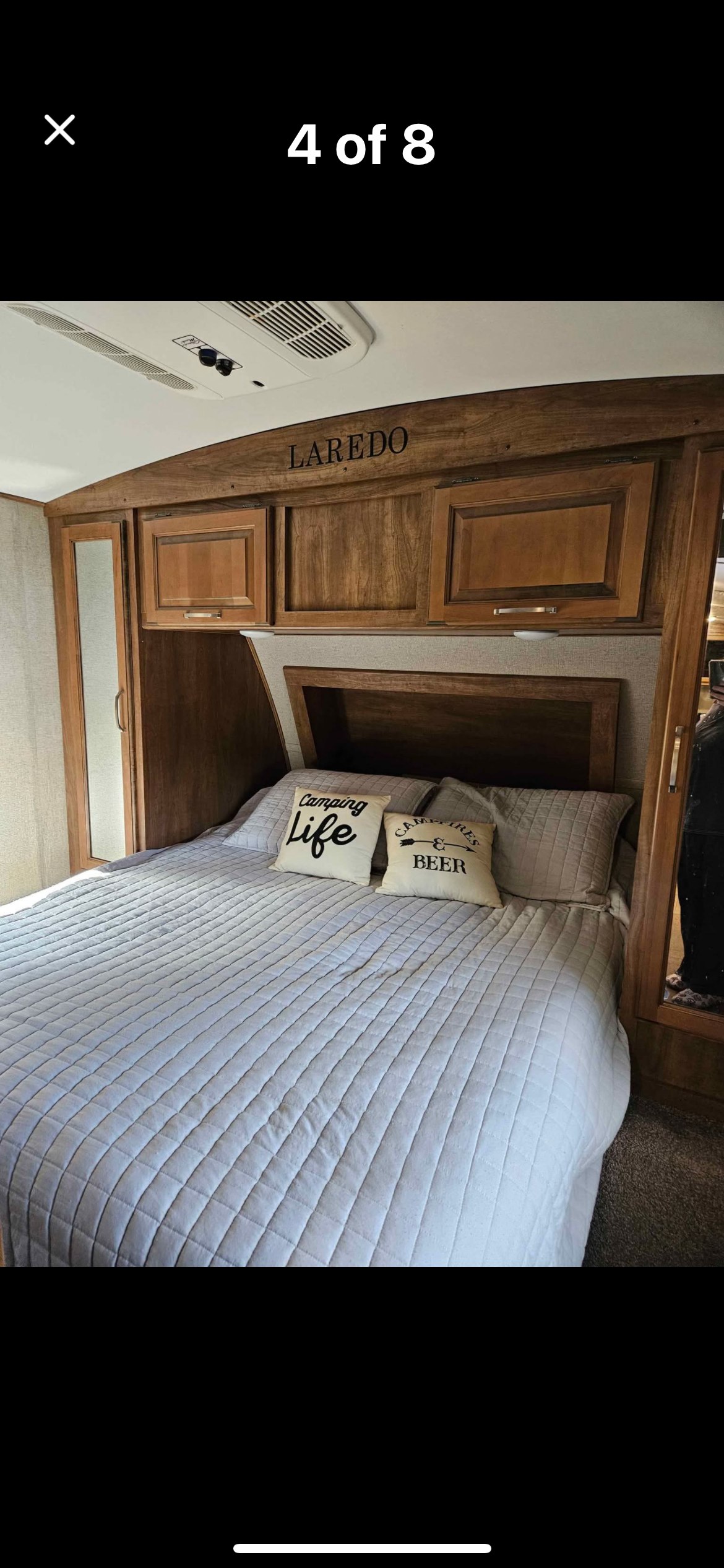 Comfortable RV bedroom, featuring Laredo trim, AC, and cozy bedding, perfect for your RV rental adventure.. Keystone RV Laredo 2019