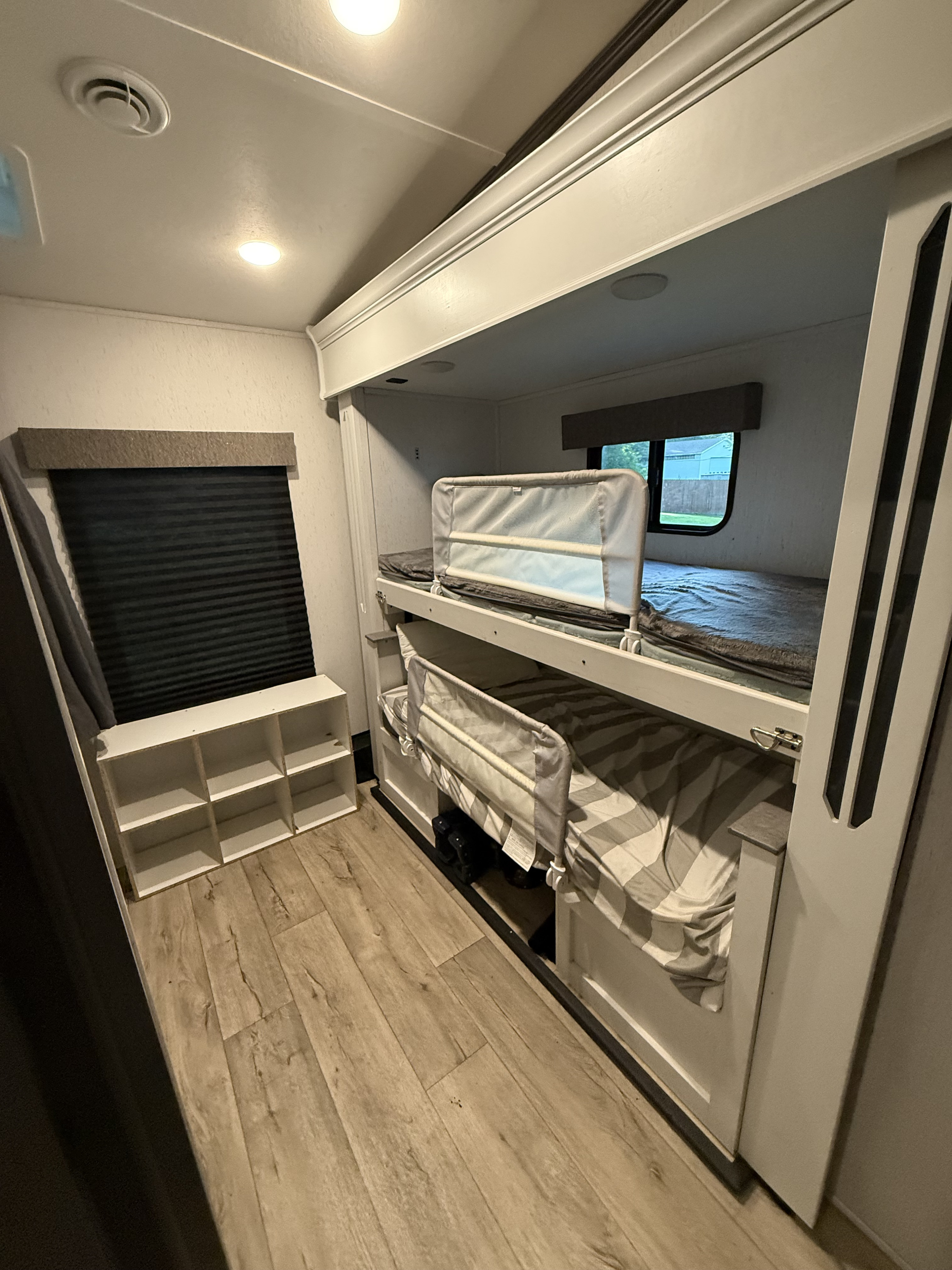 Explore this comfy RV rental bunkhouse with safe beds, window views, and storage, perfect for your next family trip.. Astoria Astoria Fifth Wheel 2023