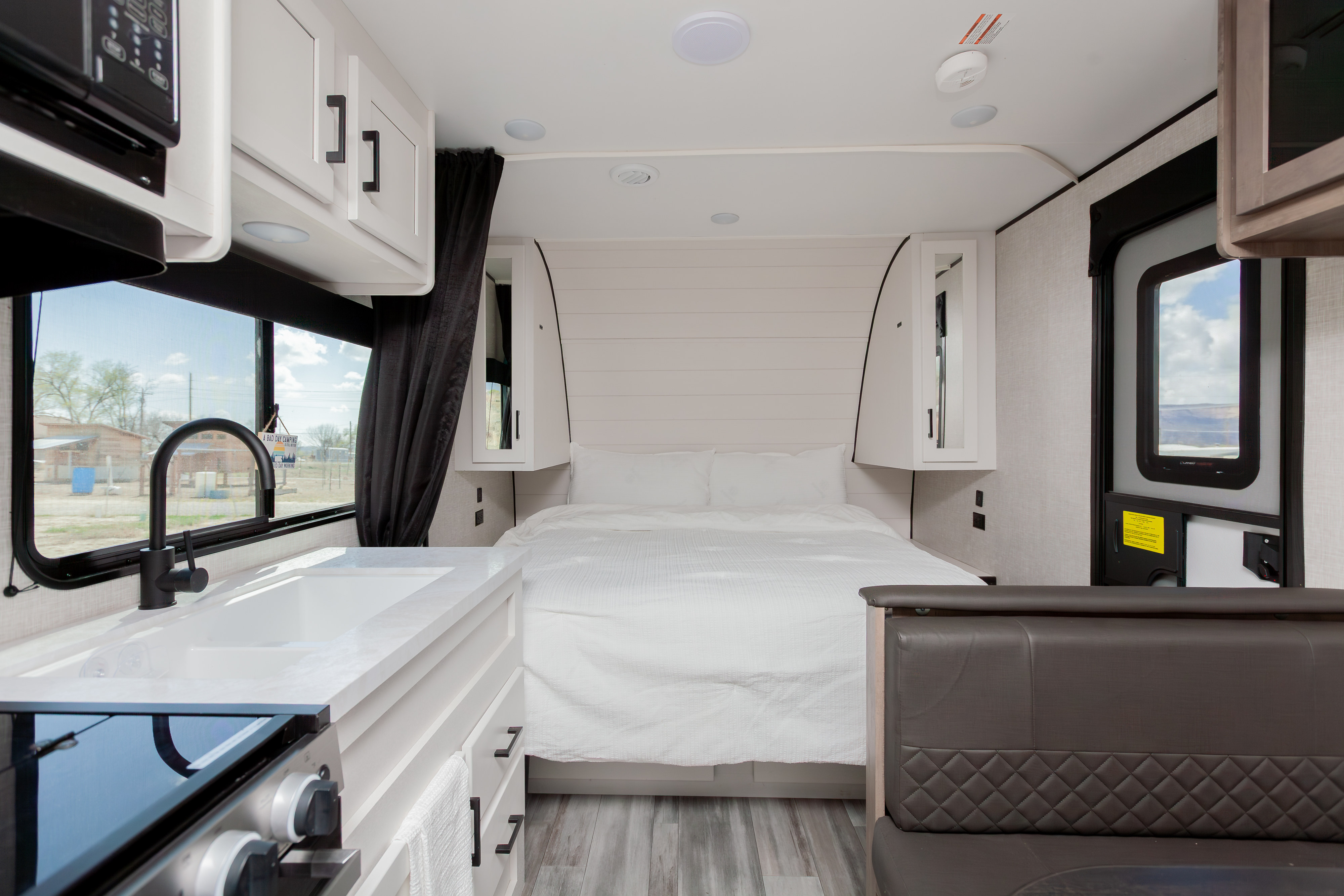 Spacious RV rental interior featuring a cozy bedroom, full kitchen, and comfortable seating. Perfect for your next adventure.. Jayco Jay Flight SLX 2024