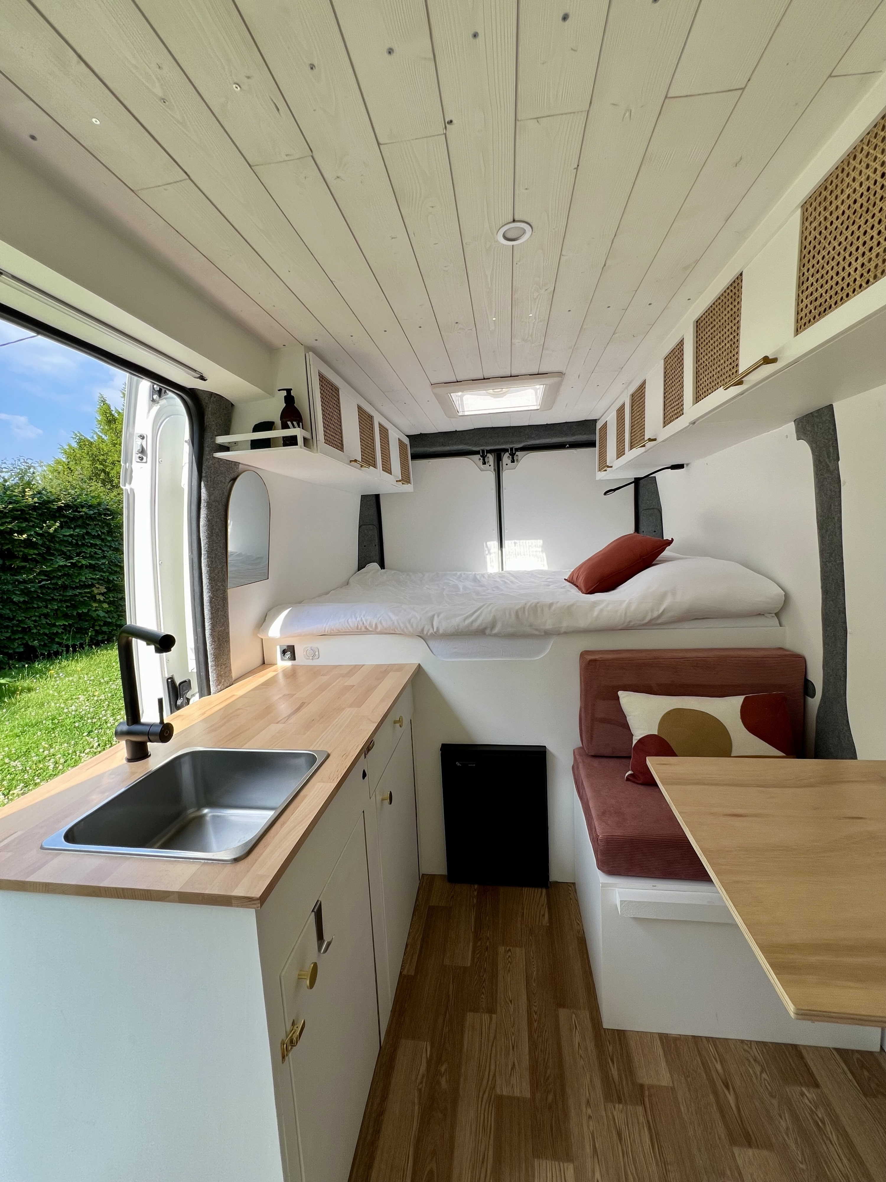 Spacious & modern camper van interior, perfect for your next rv rental adventure. Features a kitchen, bed & dining area.. Peugeot Boxer 2021