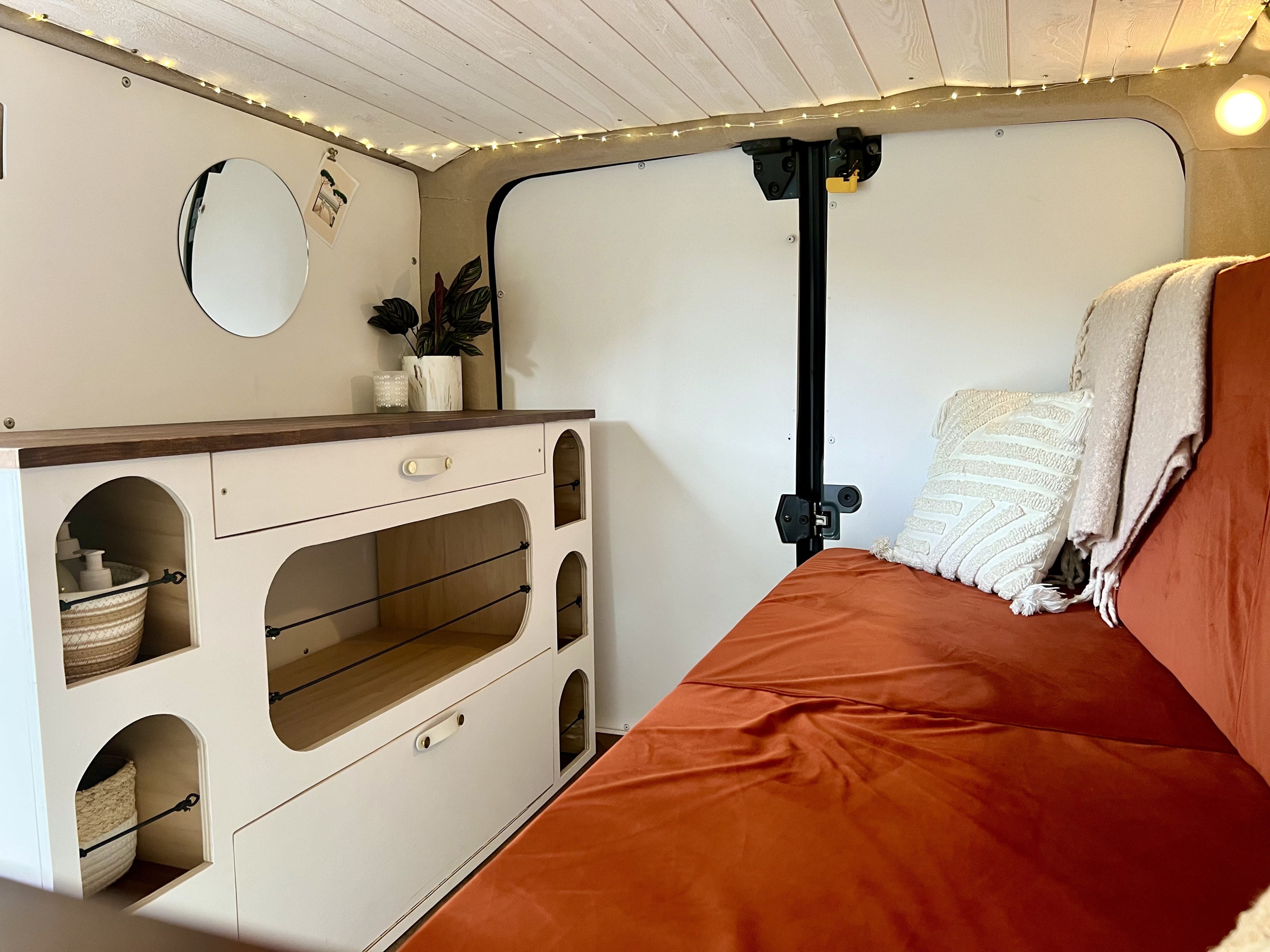 Cozy RV rental interior with bed, storage, and ambient lighting, perfect for travel.. Renault Trafic 2023