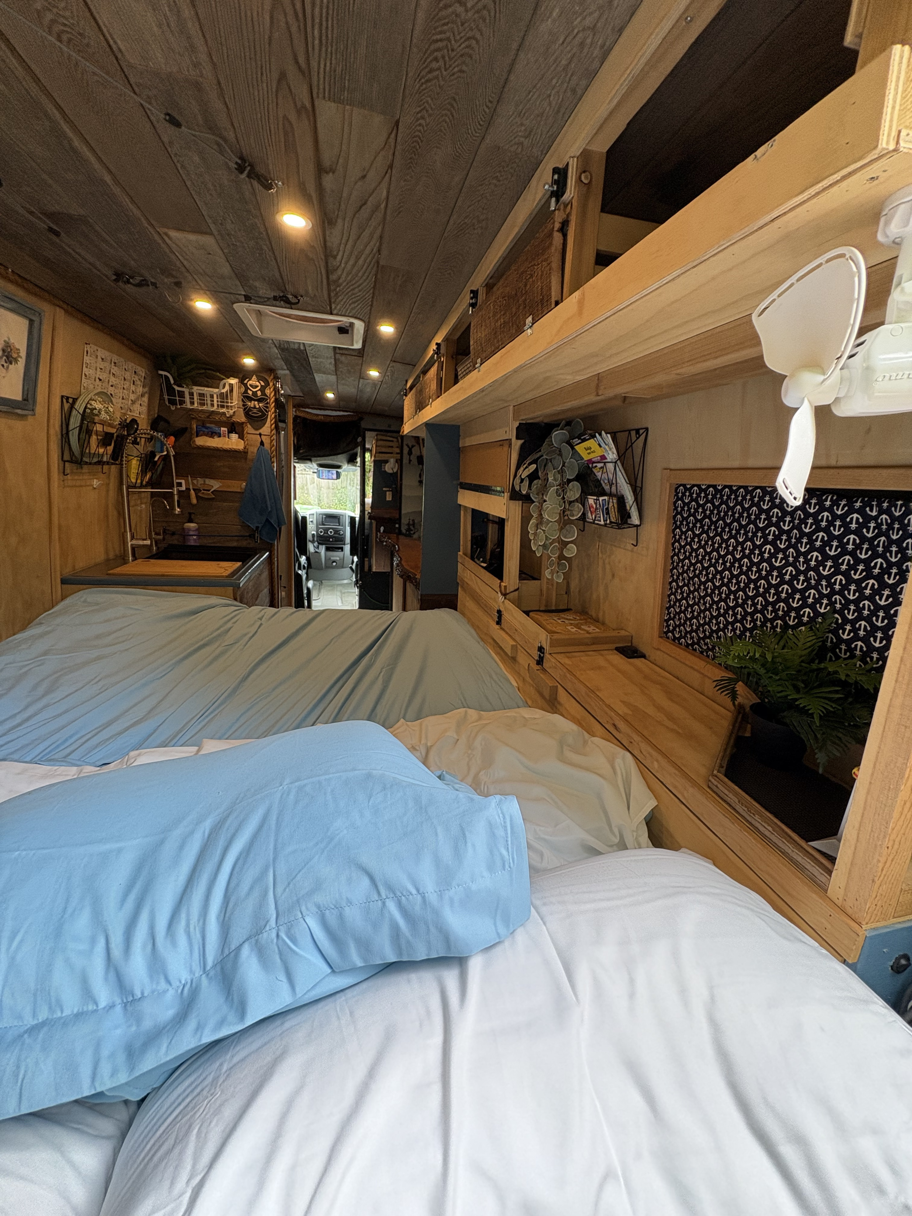Step inside this comfortable RV rental. Features a cozy bed, compact kitchen, and ample storage for your journey.. Mercedes-Benz Sprinter RV Motorhome Campervan 2011