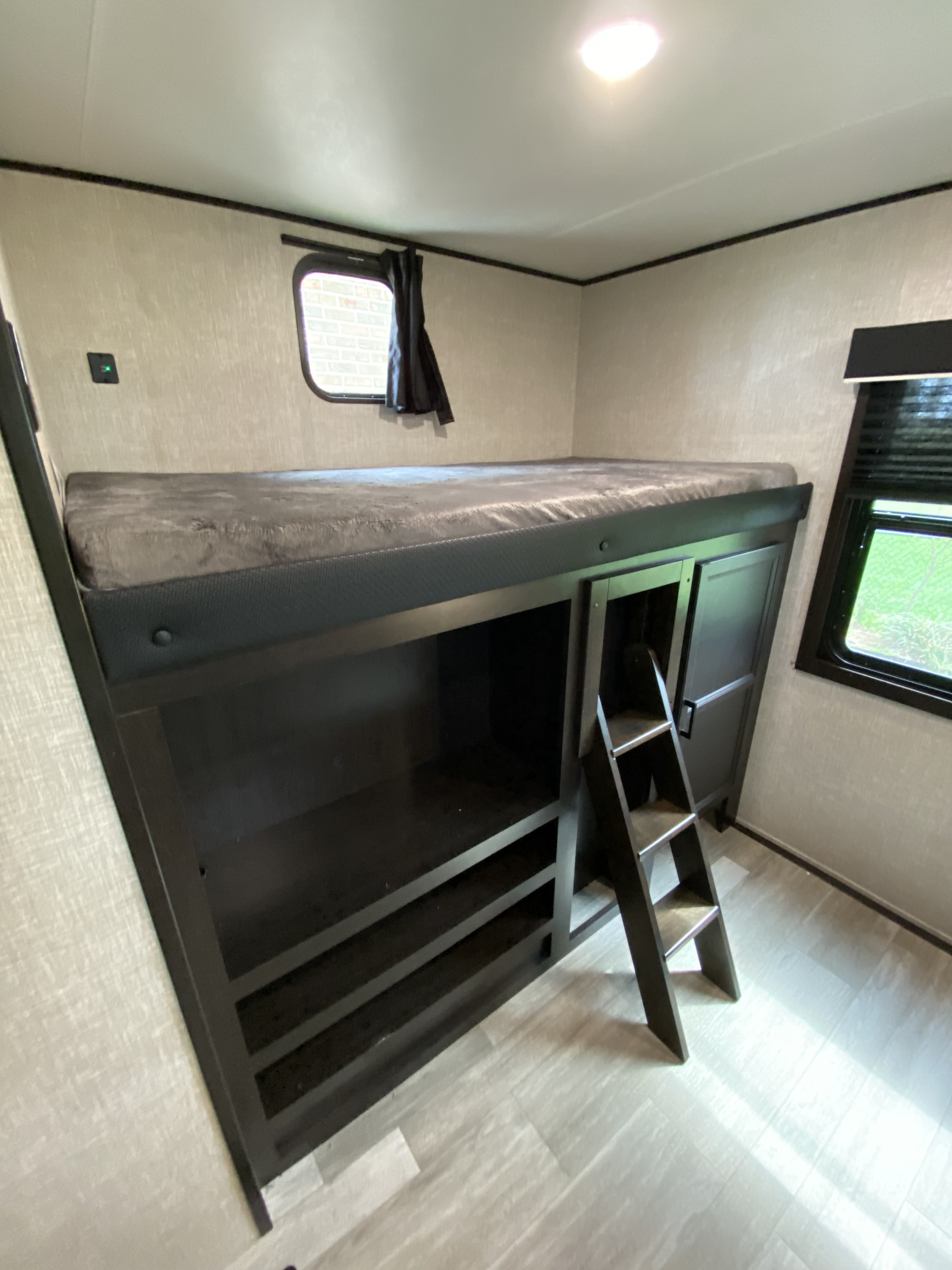 RV rental interior: clever space-saving bunk beds with a ladder & built-in storage.. Jayco Jay Flight SLX 2022