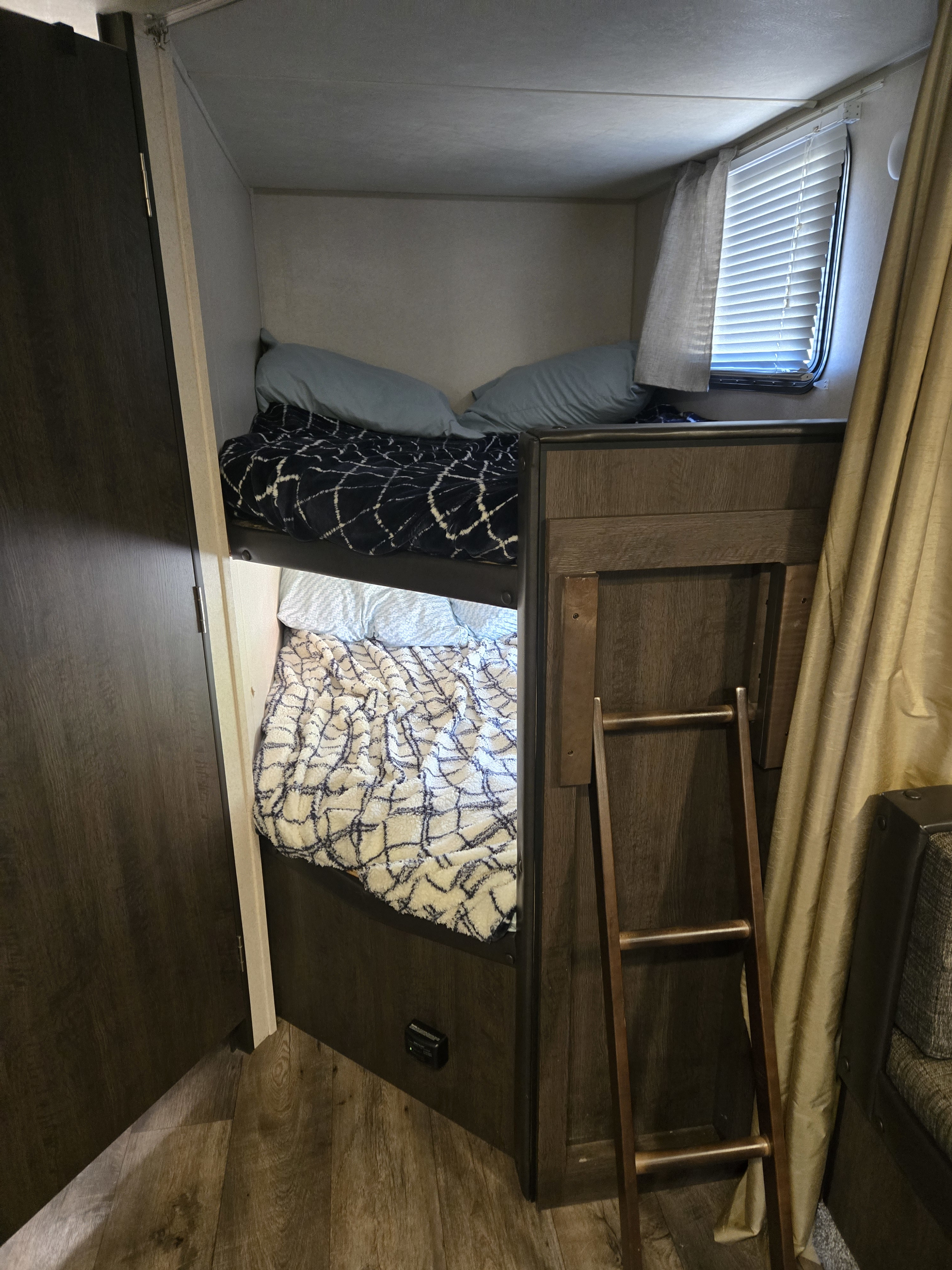 Sleep soundly in your RV rental with these comfortable bunk beds, complete with cozy bedding and easy ladder access.. Forest River Salem Cruise Lite 2018