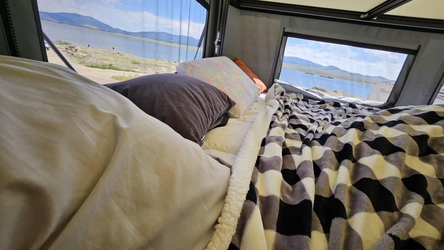 Cozy rv rental interior with a stunning lake and mountain view from the bed.. Ford Ford F150 2017