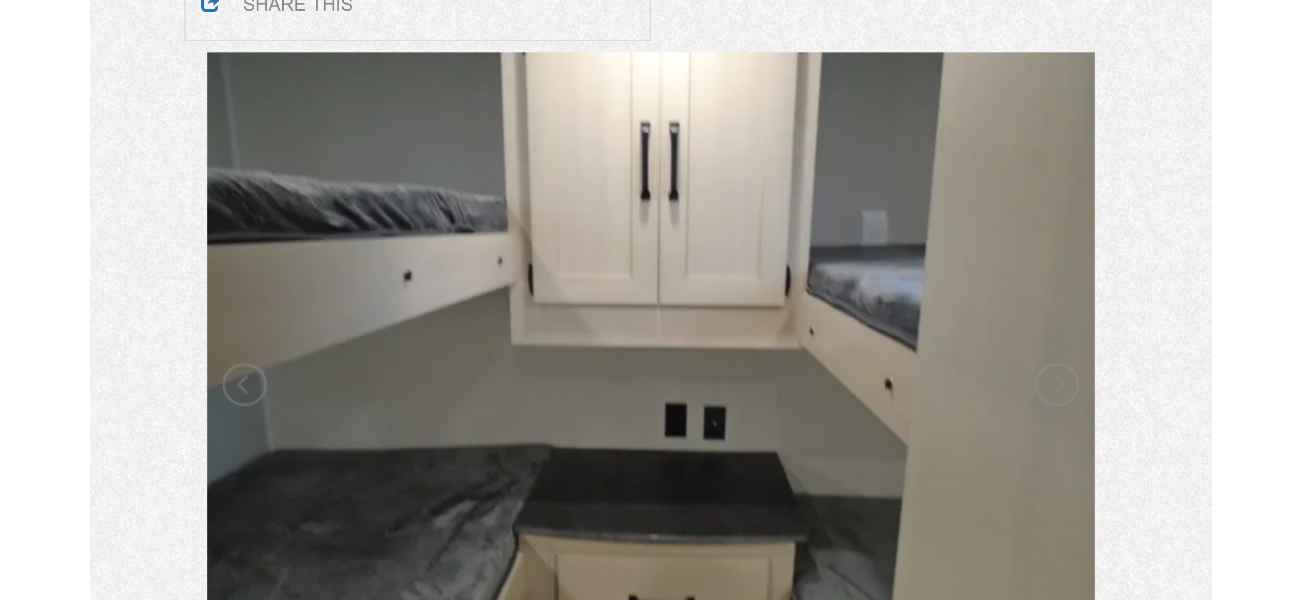 Spacious RV rental bunkhouse: two beds, white cabinets, and a counter. Ideal for family travel accommodations.. Palomino PUMA XLE 2023