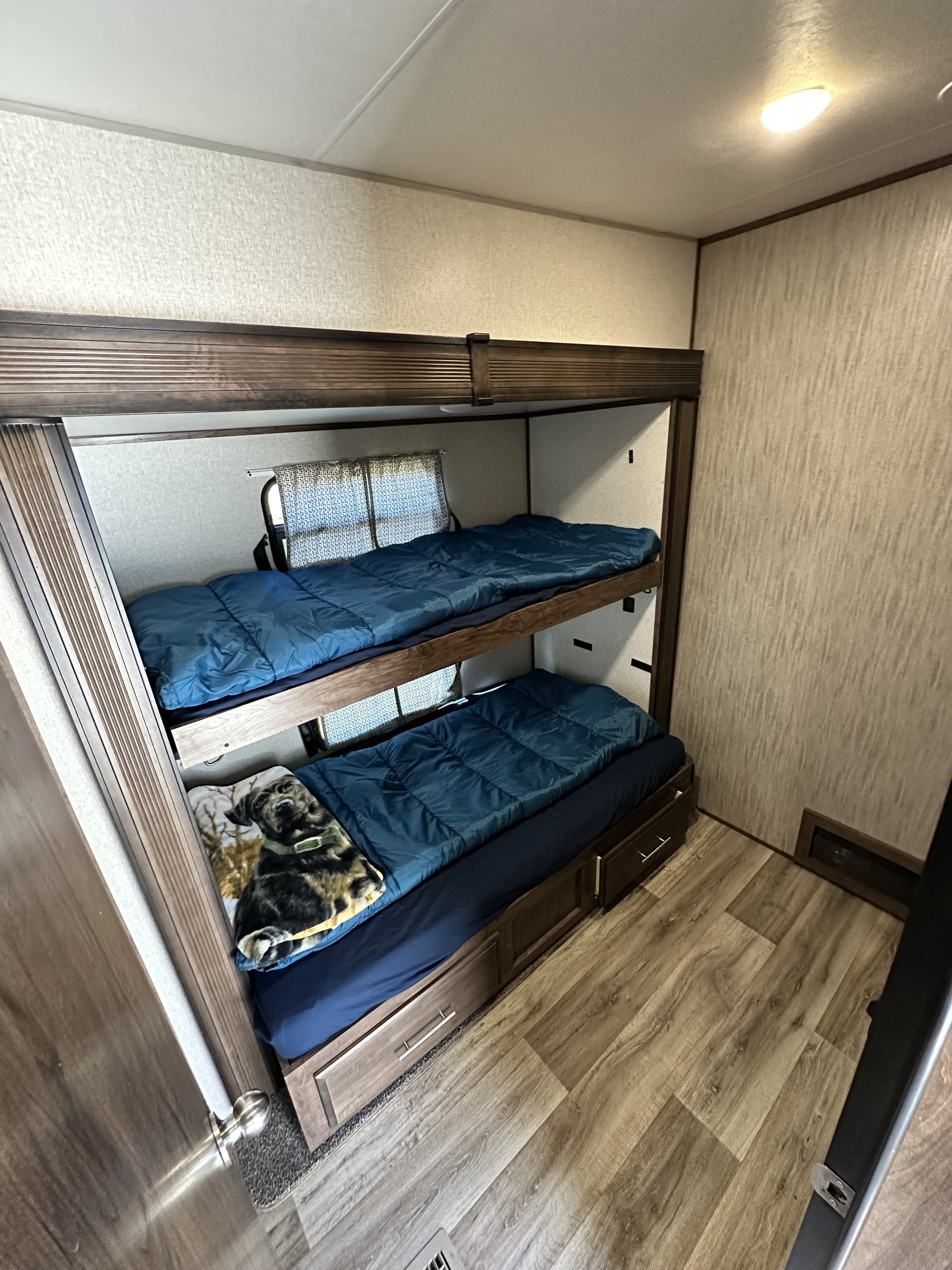 Cozy RV rental bunk beds, ideal for family road trip adventures and mobile lodging.. KZ Durango 2021