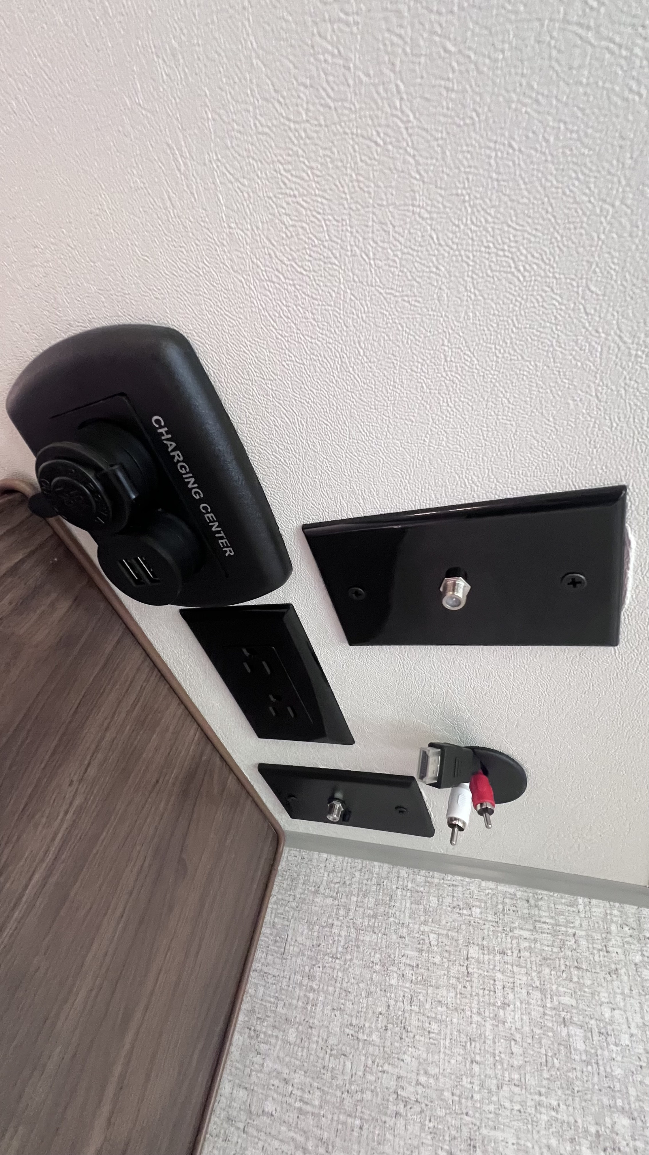 RV rental interior featuring a charging center with USB, power outlets, coaxial, HDMI, and RCA ports for convenient power and media access.. Nash Nash Trailer 2022