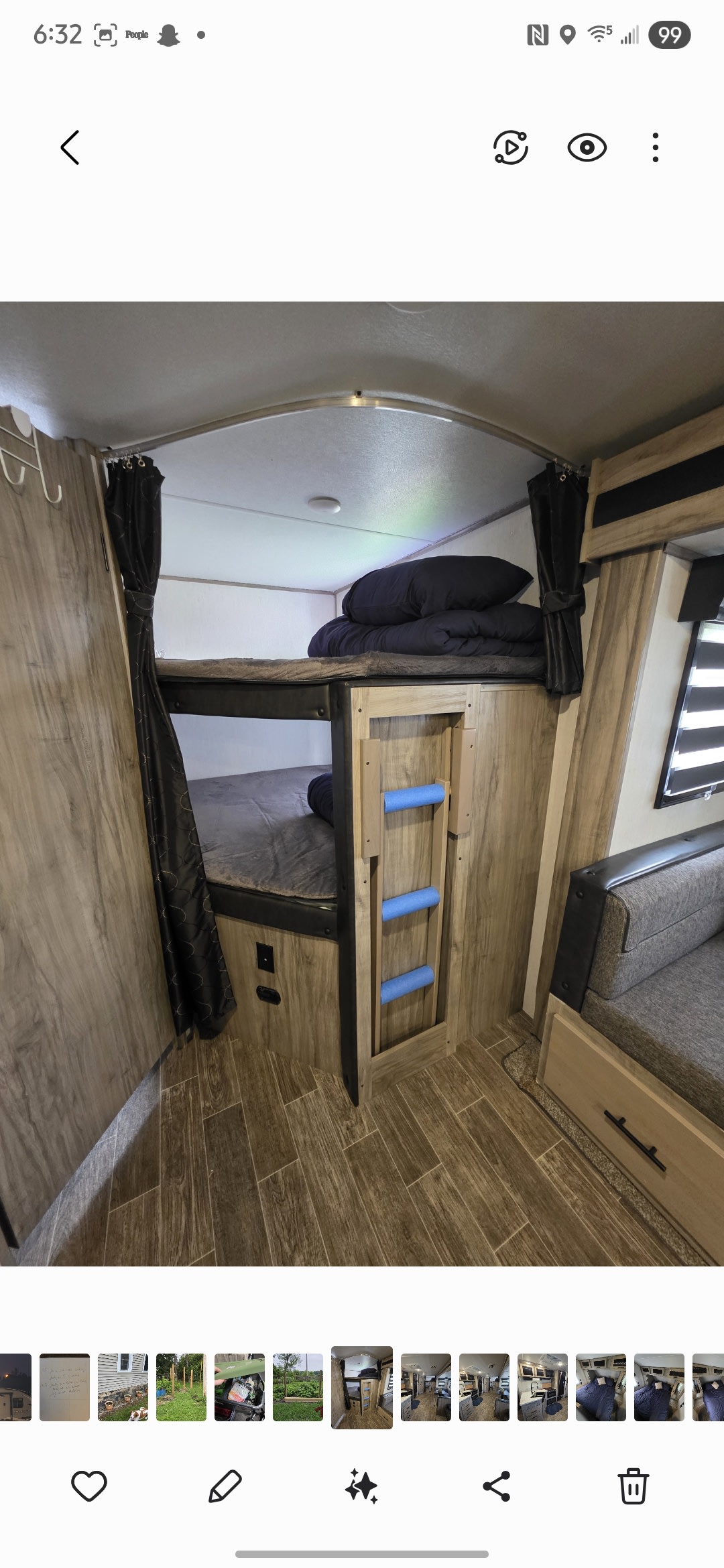 Cozy RV rental bunk bed area with two bunks, a ladder, curtains, and a nearby sofa, perfect for compact sleeping.. Forest River Cherokee Alpha Wolf 2021