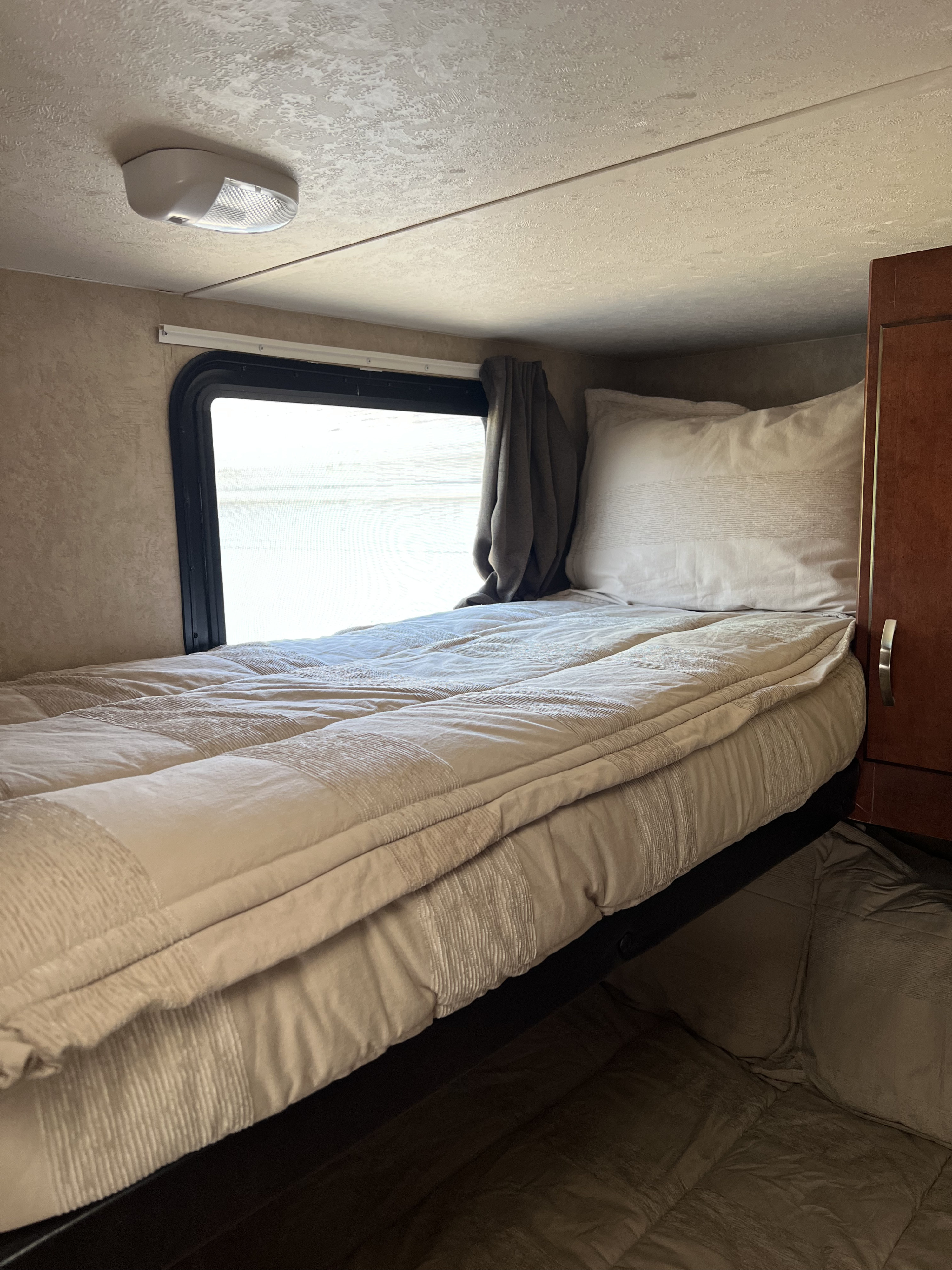 Cozy RV rental bunk bed, ready for a comfortable family adventure.. Forest River EVO 172BH 2017