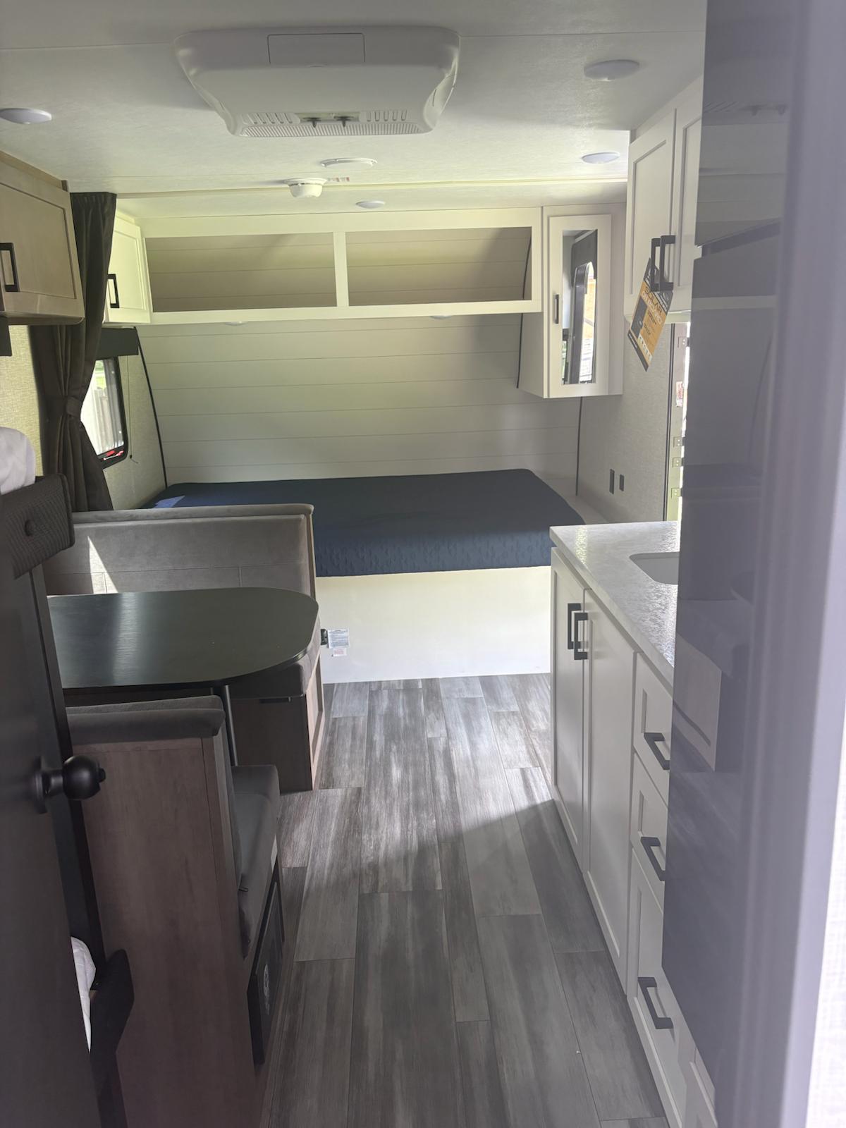 Step inside this modern RV rental! Features a comfortable bed, functional dinette, and compact kitchen.. Jayco Jay Flight SLX 2025