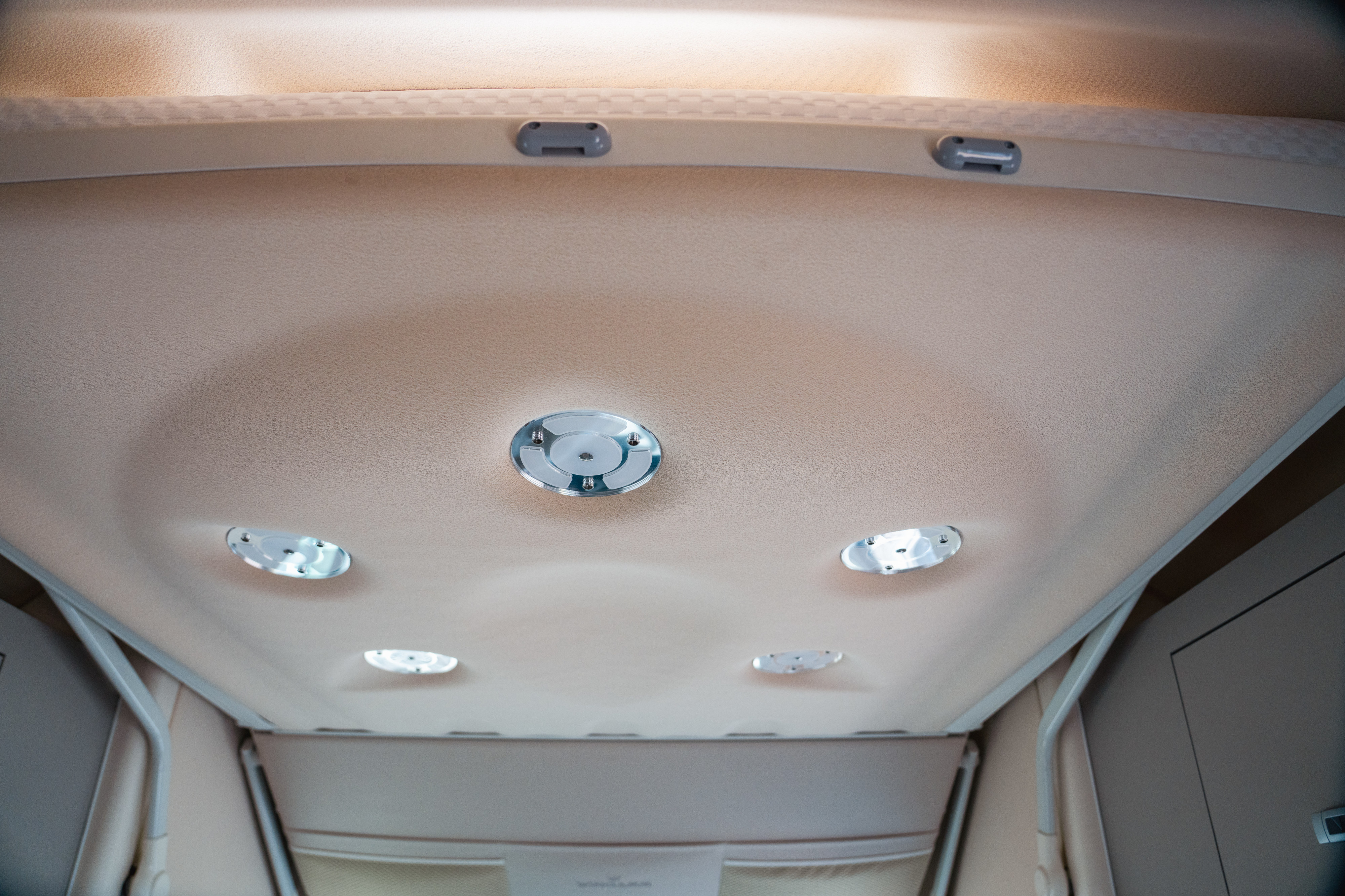 RV rental's cozy interior features a plush, illuminated ceiling with modern circular lights. Ideal for travel comfort.. WINGAMM OASI 540 2025