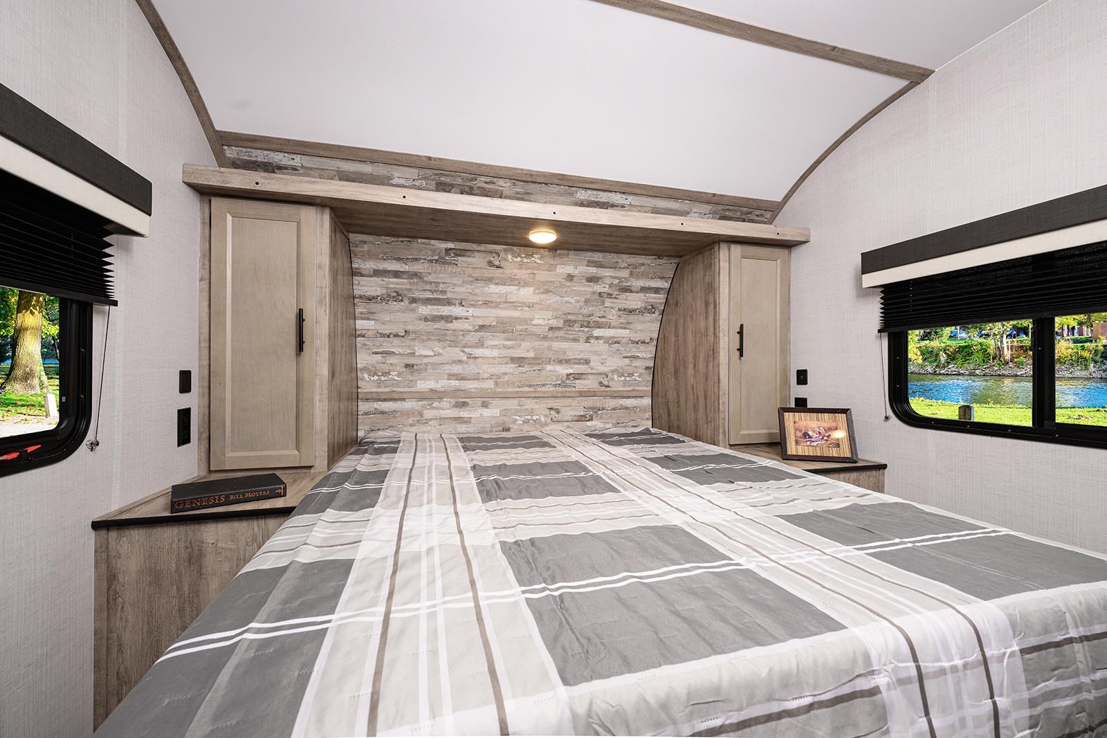 Comfortable RV rental bedroom with a cozy bed, ample storage, and scenic window views for your next adventure.. Gulf Stream Conquest 2023