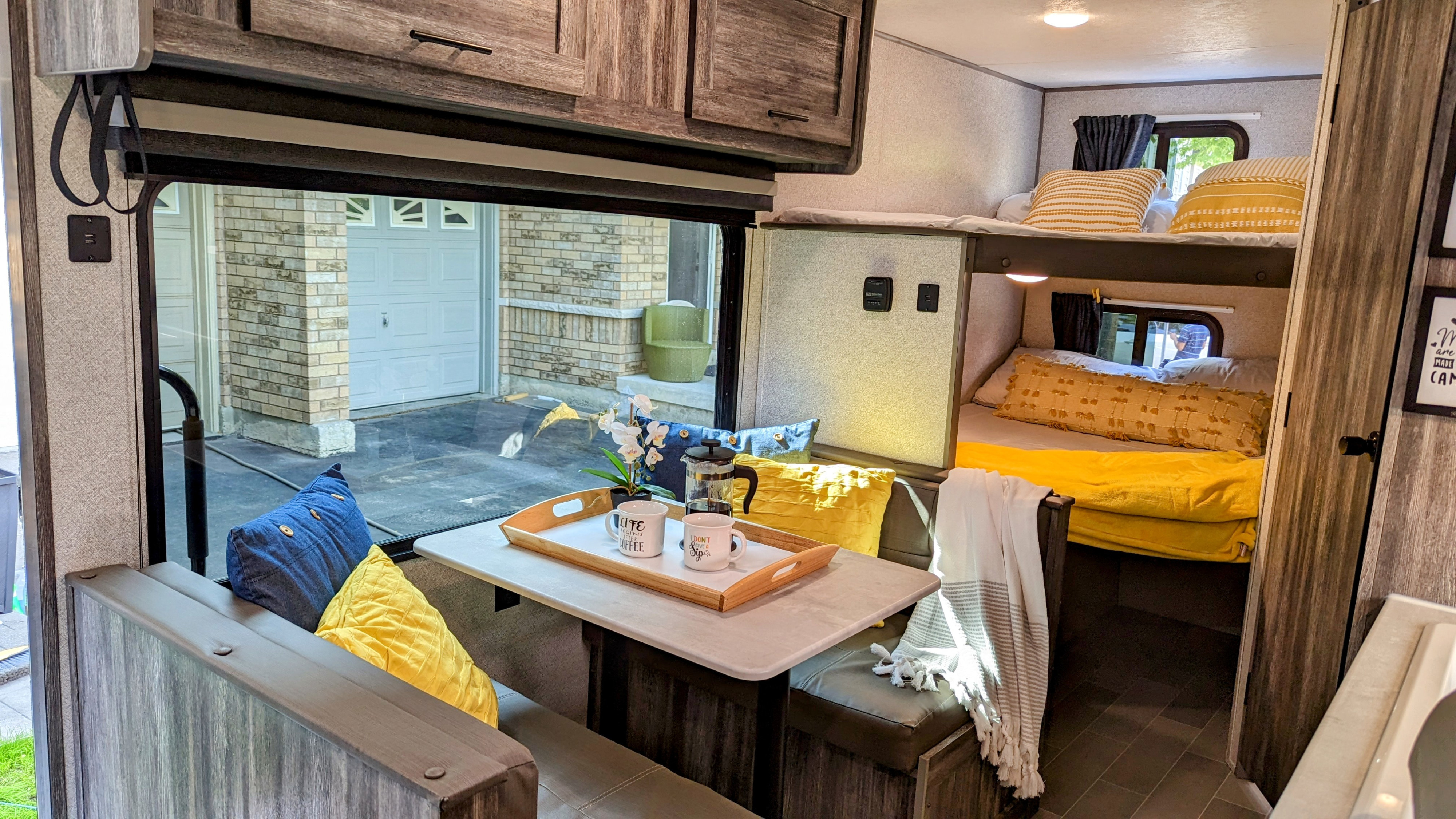 Cozy, modern RV rental: bright dinette, comfortable bunk beds, & ample storage for travel.. Forest River Wildwood FSX 2020