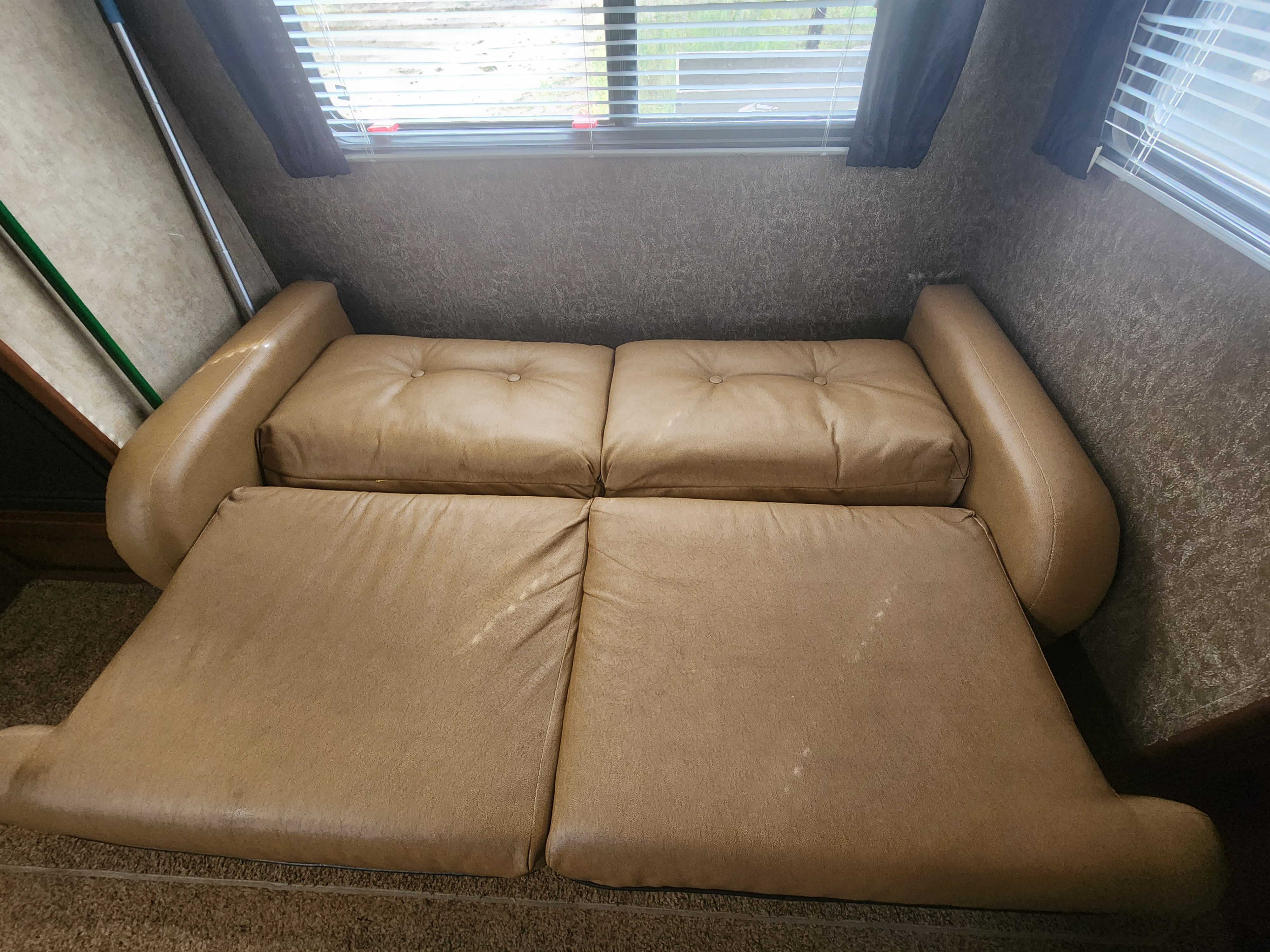 RV rental: Tan leatherette sofa converts to a bed inside this comfortable living space.. Aspen Trail Aspen Trail Trailer 2013