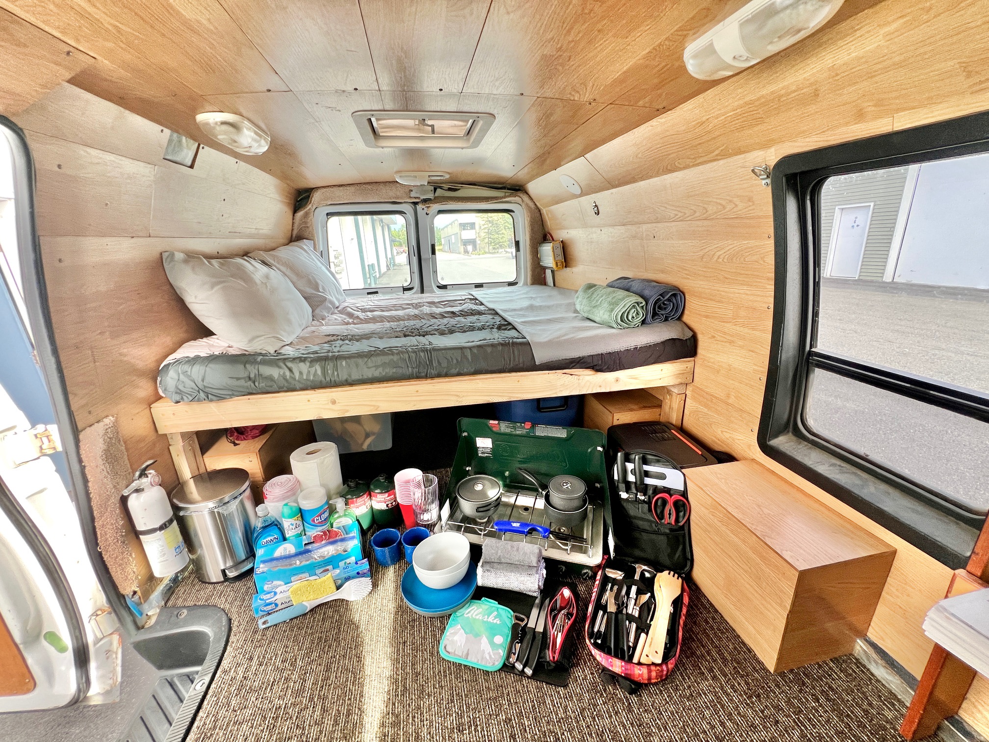 Explore this RV rental's organized interior with a comfy bed, camp kitchen, and all necessities for your trip.. Ford Econolline 250s 2006