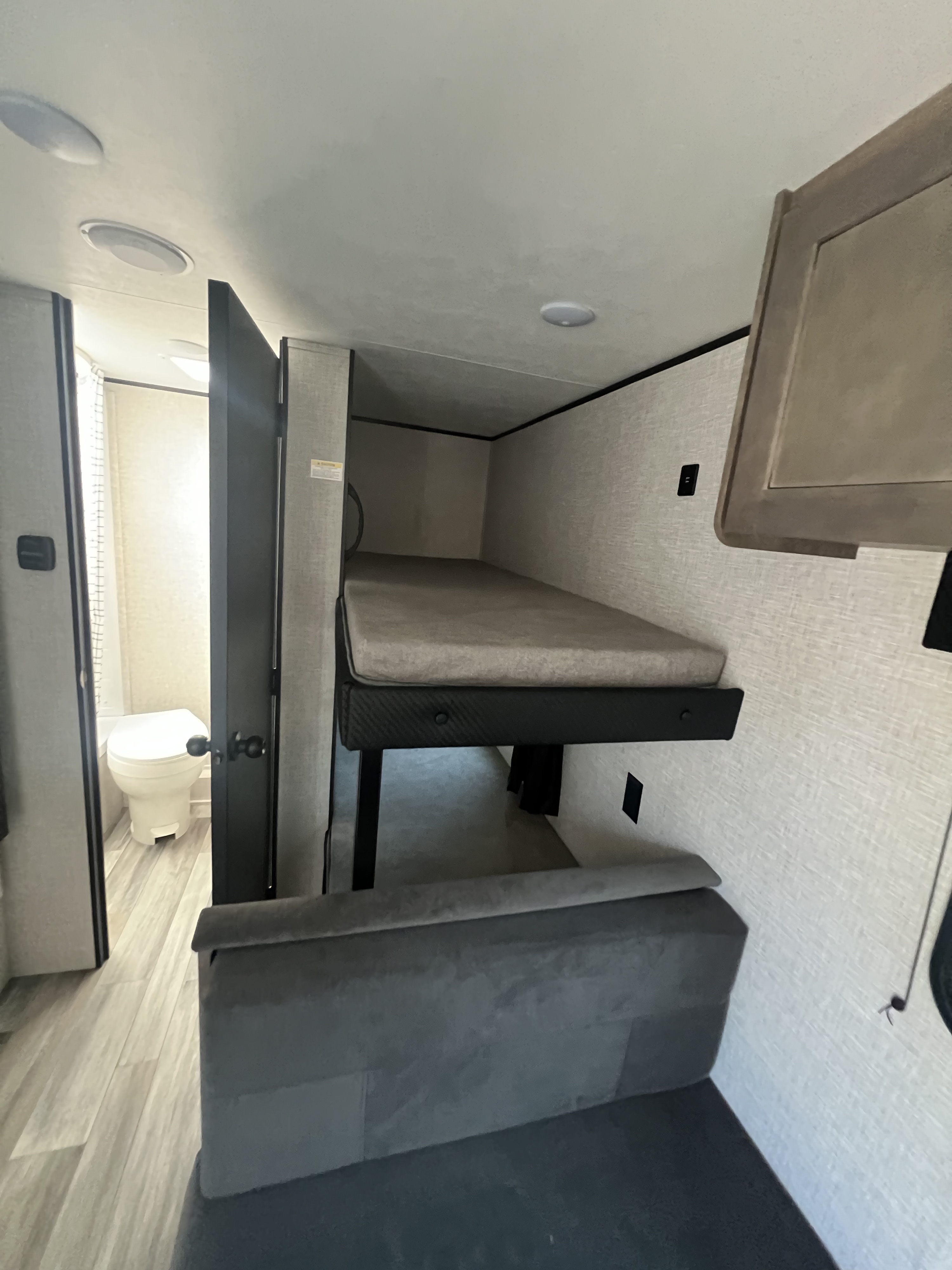 RV rental interior: bunk beds, a lower sofa/seating area, and a compact bathroom are visible.. Jayco Jay Flight SLX 175 BH 2025