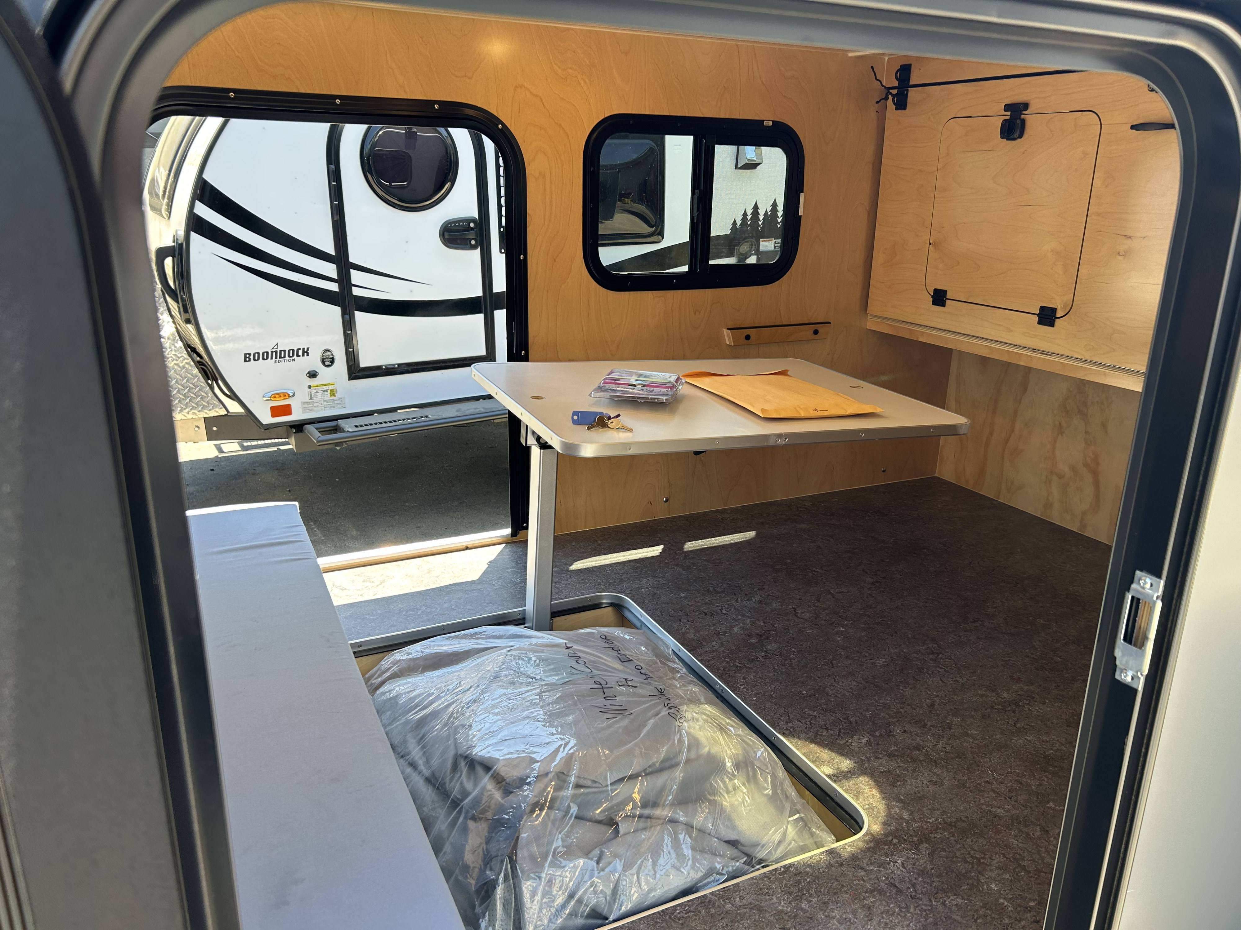 Explore this compact rv rental! Interior features wood paneling, convertible dinette, and ample storage for your journey.. Aero Build Burnside 2024