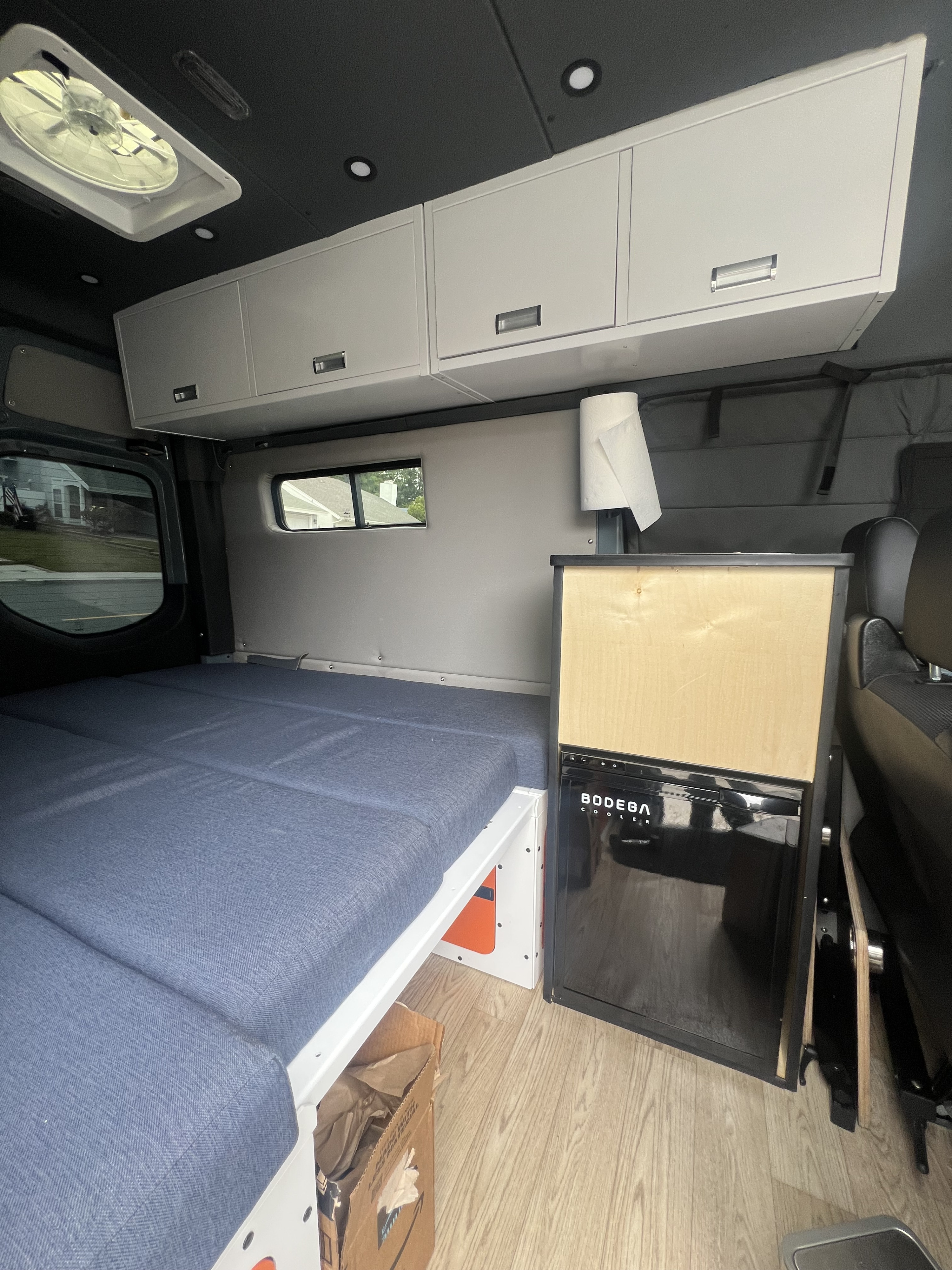 Step inside this cozy RV rental! Features a modular bed, sleek cabinets, and a BODEGA cooler, ready for your road trip.. Mercedes Sprinter 2021