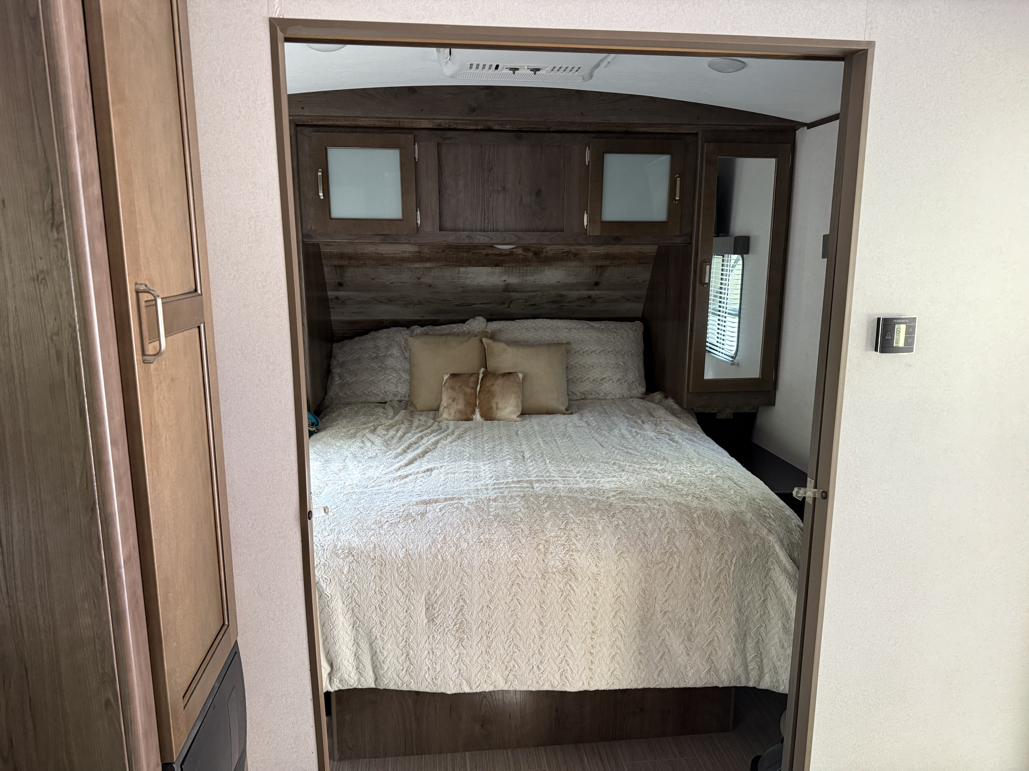 RV rental bedroom features a plush. Keystone RV Passport Grand Touring 2020