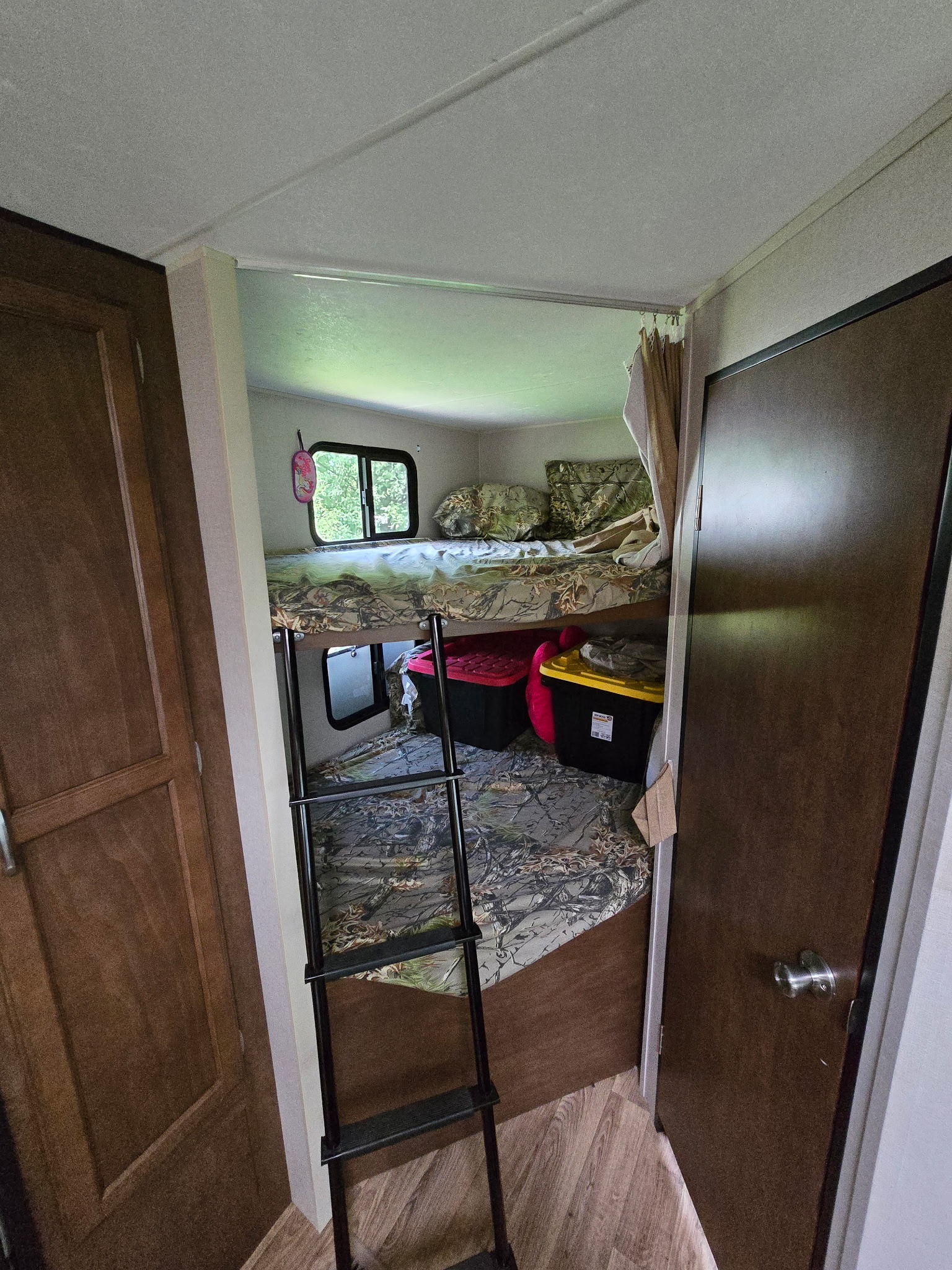 RV rental interior: cozy bunk beds with camouflage bedding & storage bins. Perfect for family adventures!. Sport Trek Sport Trek Trailer 2018