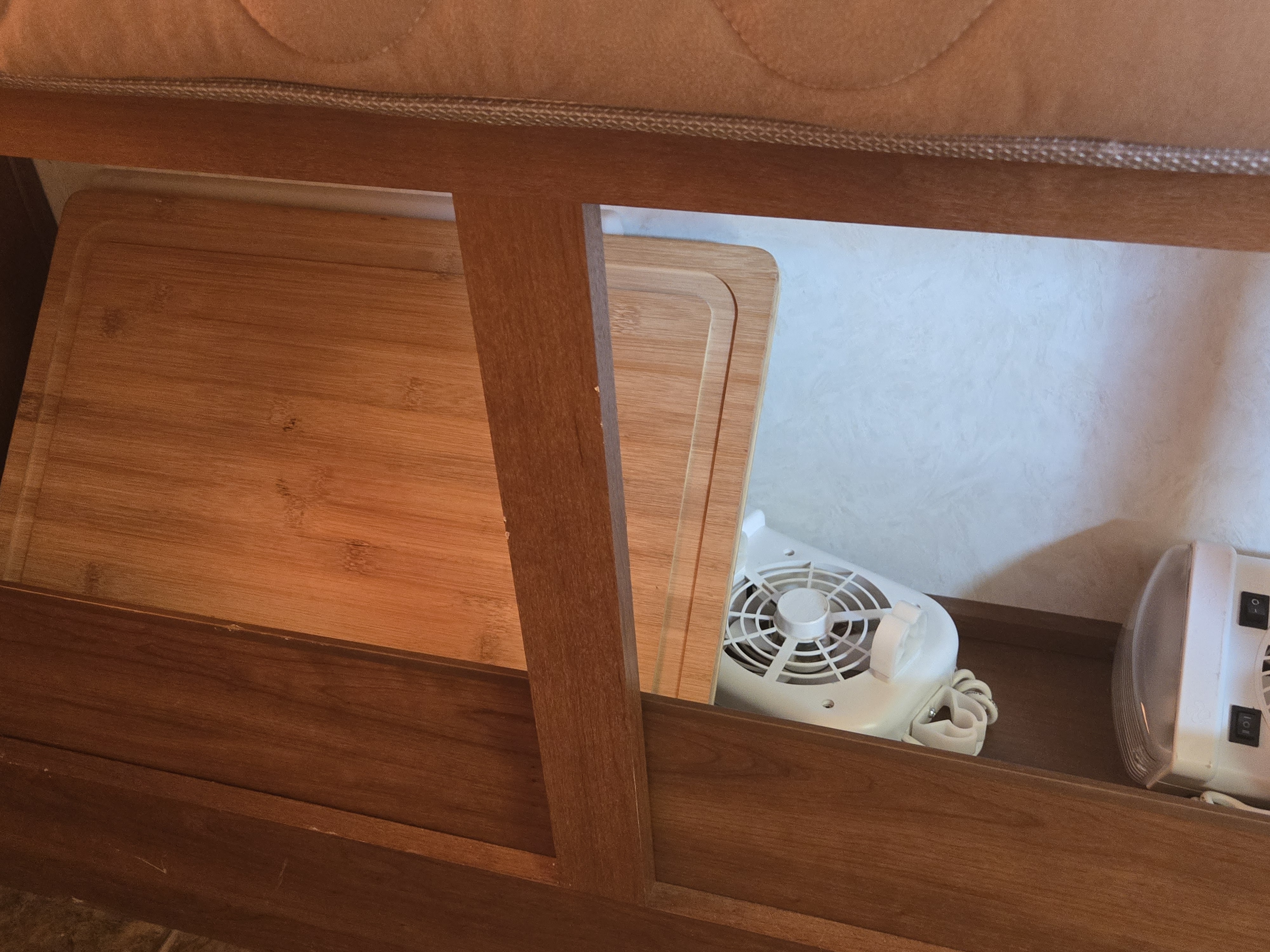 RV rental: Under-bed storage reveals cutting boards, an electric fan, and other travel essentials in a compact space.. Coachmen Freedom express ltz 2014