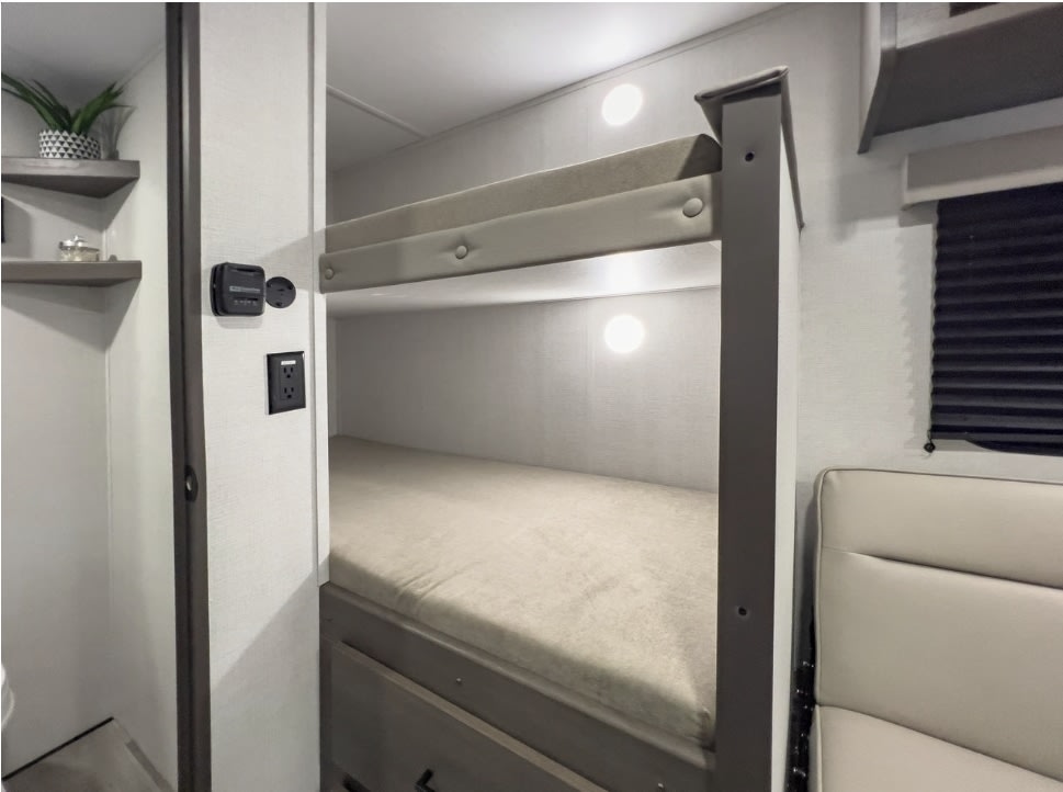 Cozy RV bunk beds with individual lighting, an outlet, and climate control, perfect for your next rv rental adventure.. Grand Design Transcend One 151BH 2025