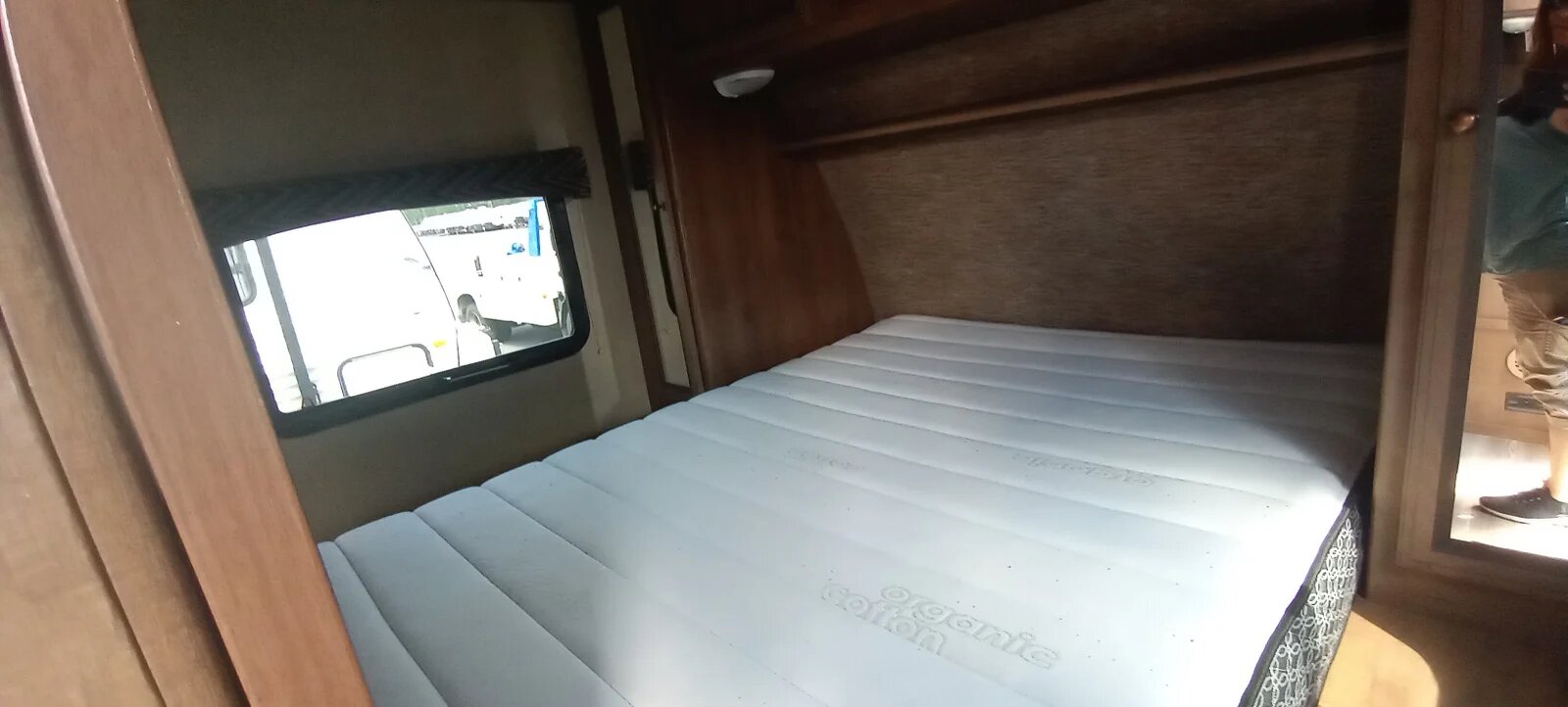 Cozy RV rental bedroom featuring a white organic cotton mattress, perfect for comfortable travel accommodation.. Cruiser RV Shadow Cruiser 2017