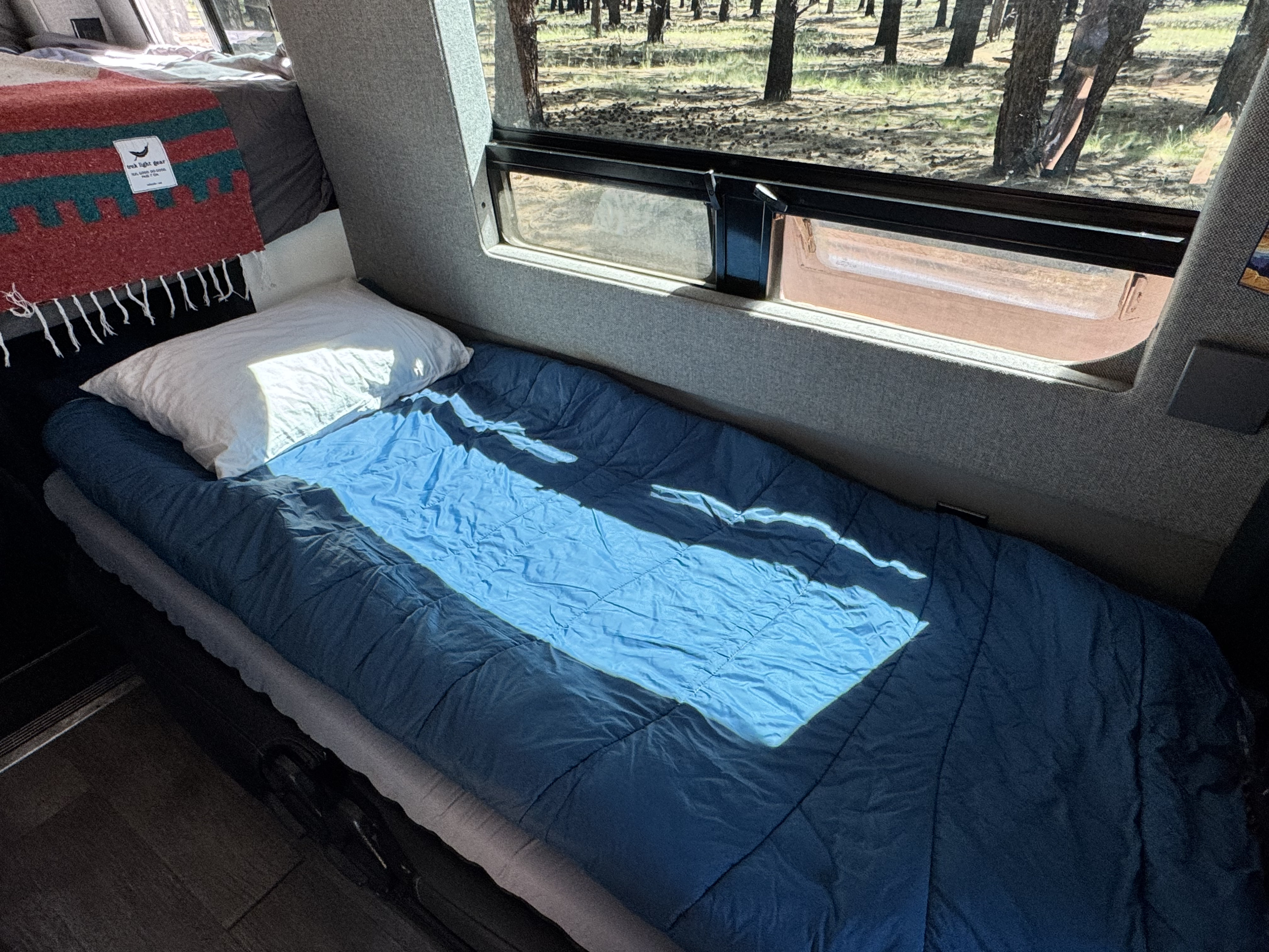 The twin bed is 6 feet 5 inches long and includes a Hest Foamy sleeping pad.. Storyteller Overland Storyteller Overland Class B 2021