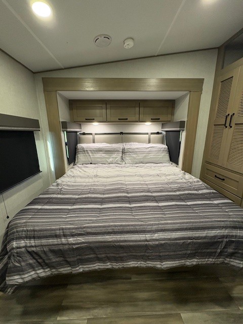 Private rear bedroom with upgraded king bed gives even more room to relax.. Grand Design Reflection 2024
