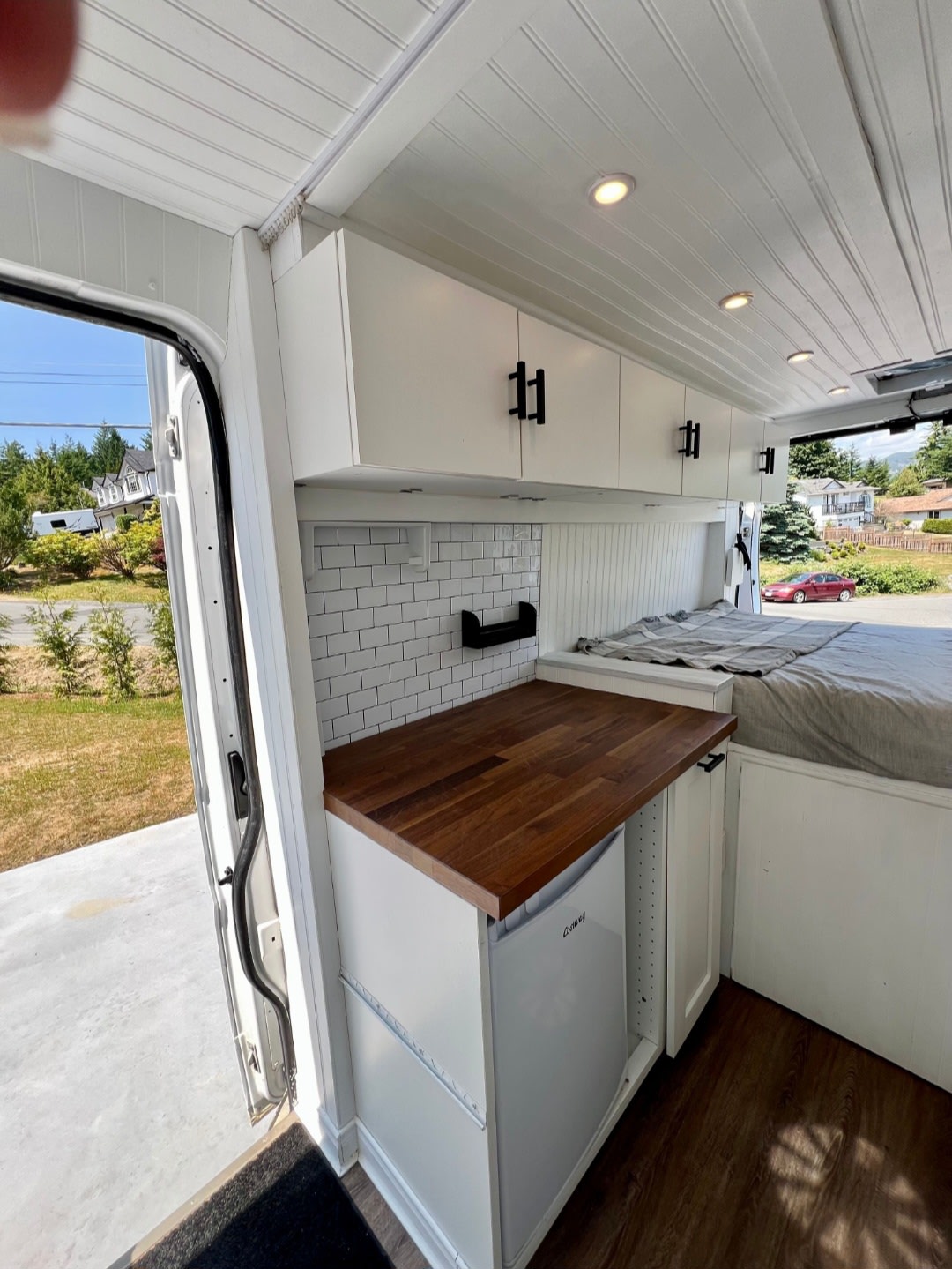 Spacious camper van interior for your next RV rental. Features kitchenette, bed, and ample storage.. Dodge Promaster 3500 Extended 2019