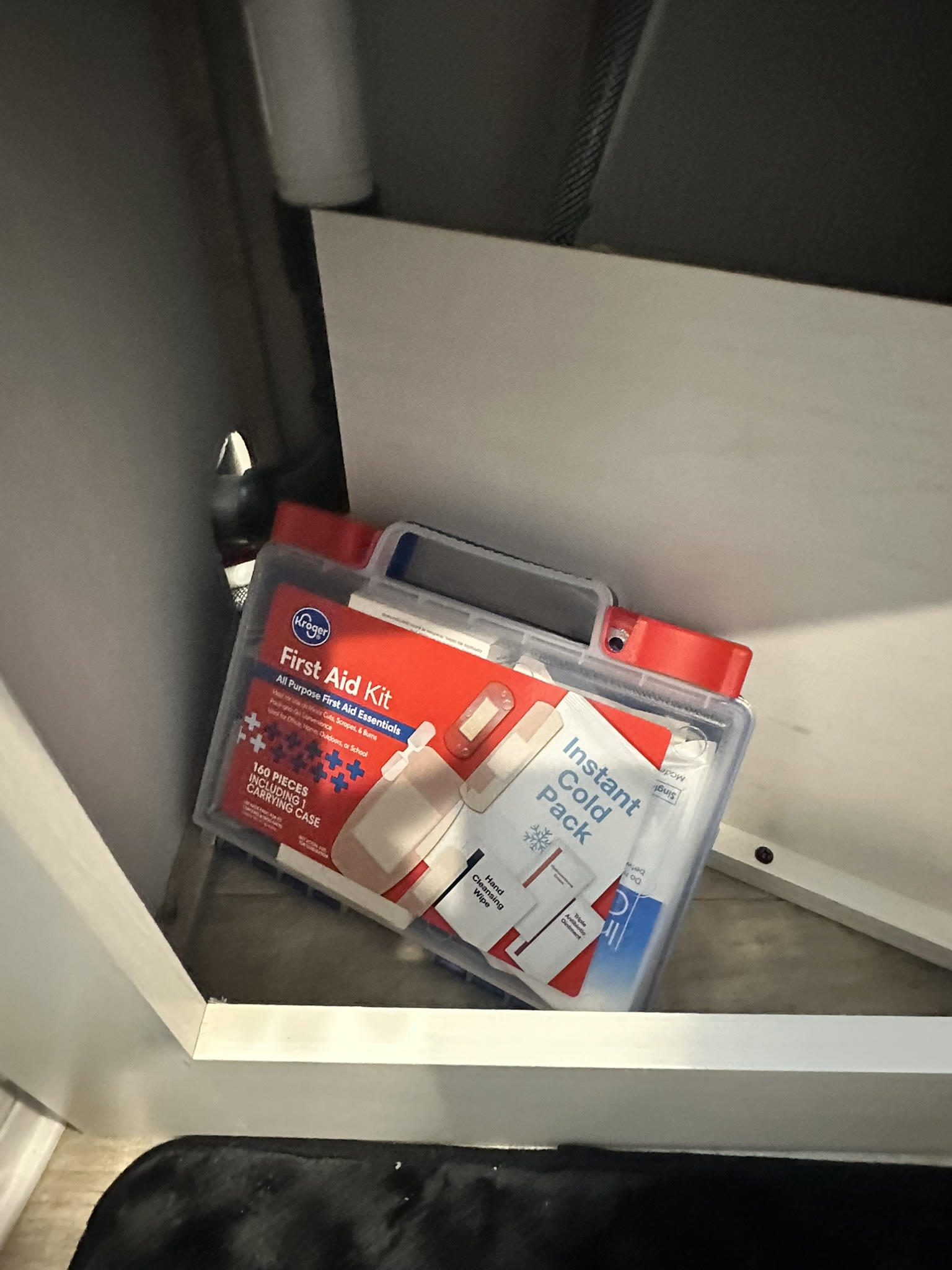 A Kroger First Aid Kit, essential for safety, stored neatly in an RV rental's compact cabinet.. Palomino Puma 2025