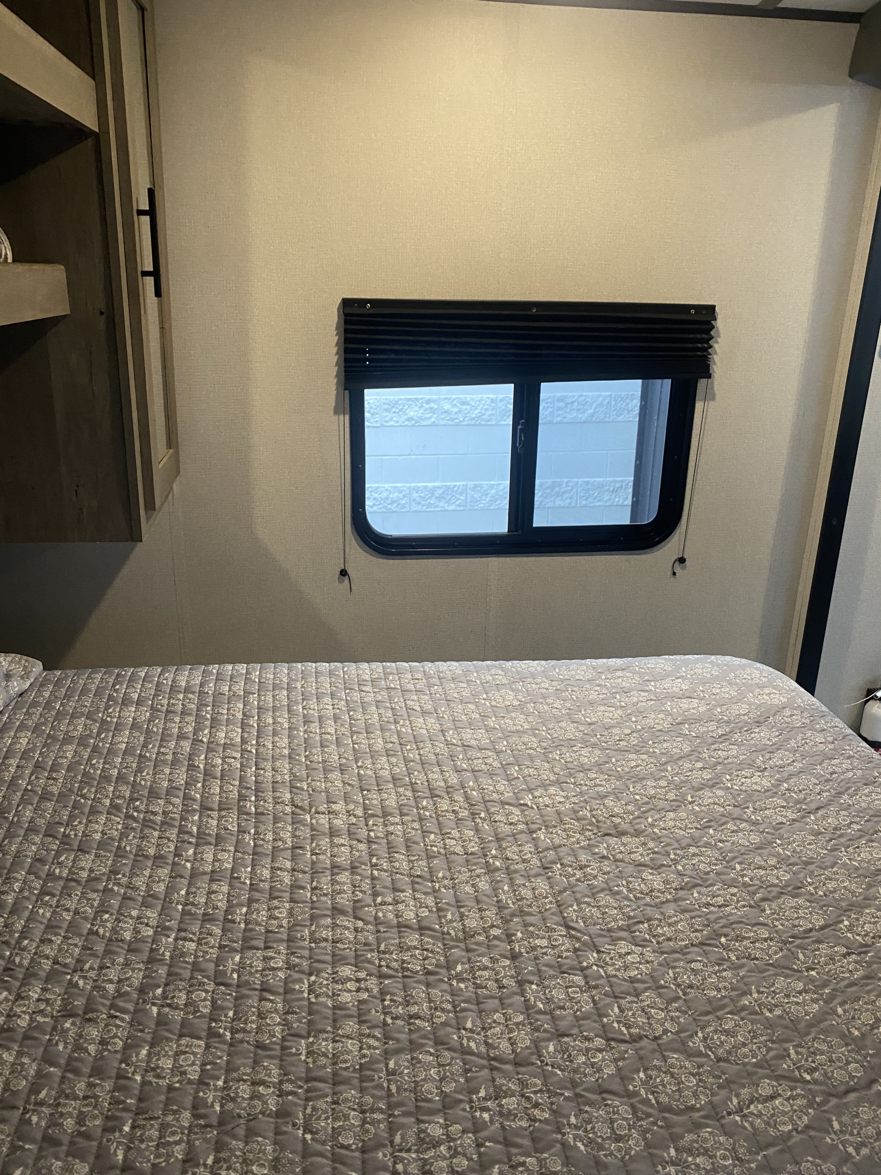 Cozy master with an upgraded 10 inch memory foam queen mattress for a great night’s rest. Master has 2 windows with blinds, and built-in storage.. Keystone RV Springdale 2021