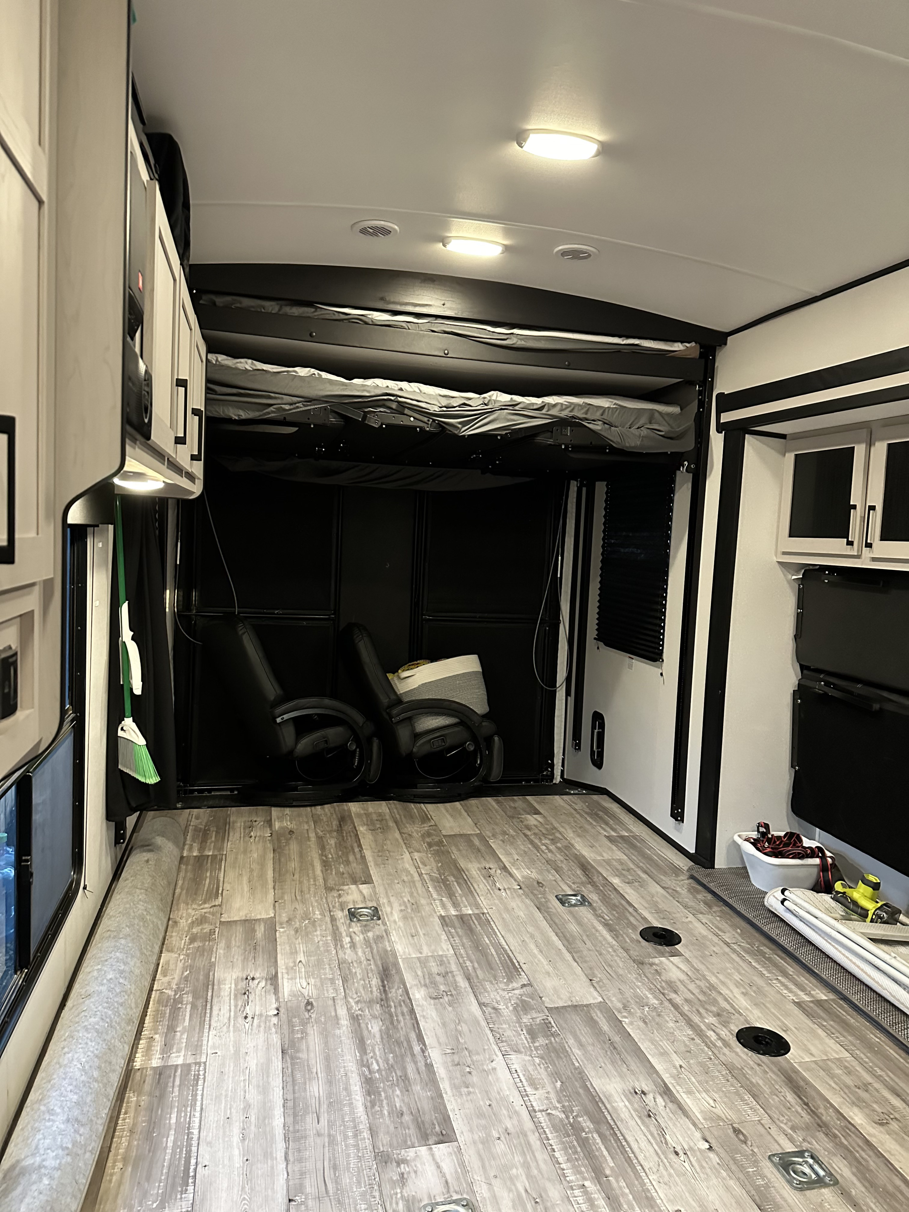 Spacious toy hauler RV rental interior: bunk beds, wood-look floor, and garage space ready for adventure.. Heartland Fuel 287 2022
