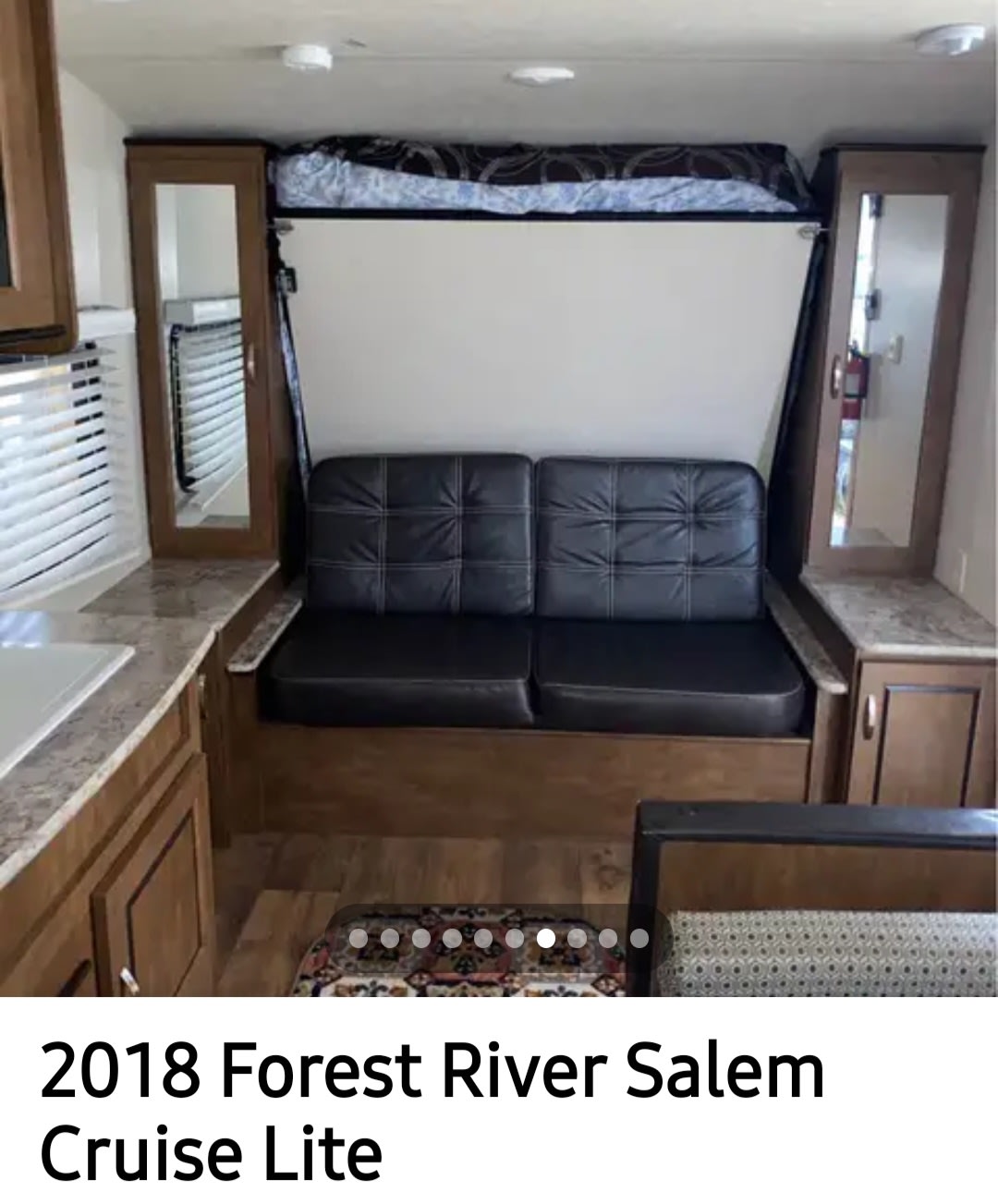 RV rental interior: A travel trailer living area with a convertible couch/bed, compact kitchen, and storage for your next trip.. Forest River Salem Cruise Lite 2018