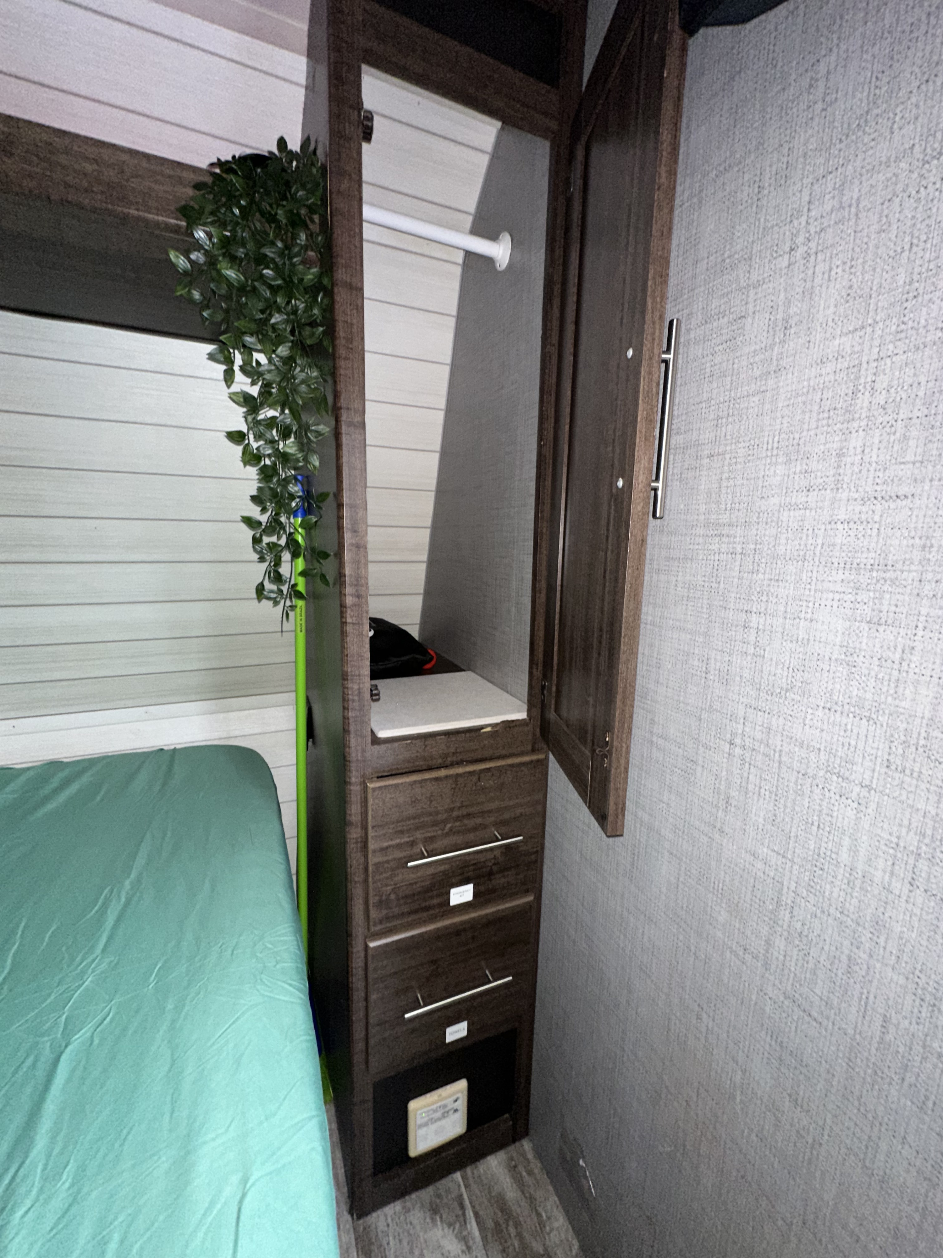 RV rental interior featuring a compact bedroom with a bed and a built-in wardrobe/closet for efficient storage.. Crossroads RV Z-1 Lite 2018