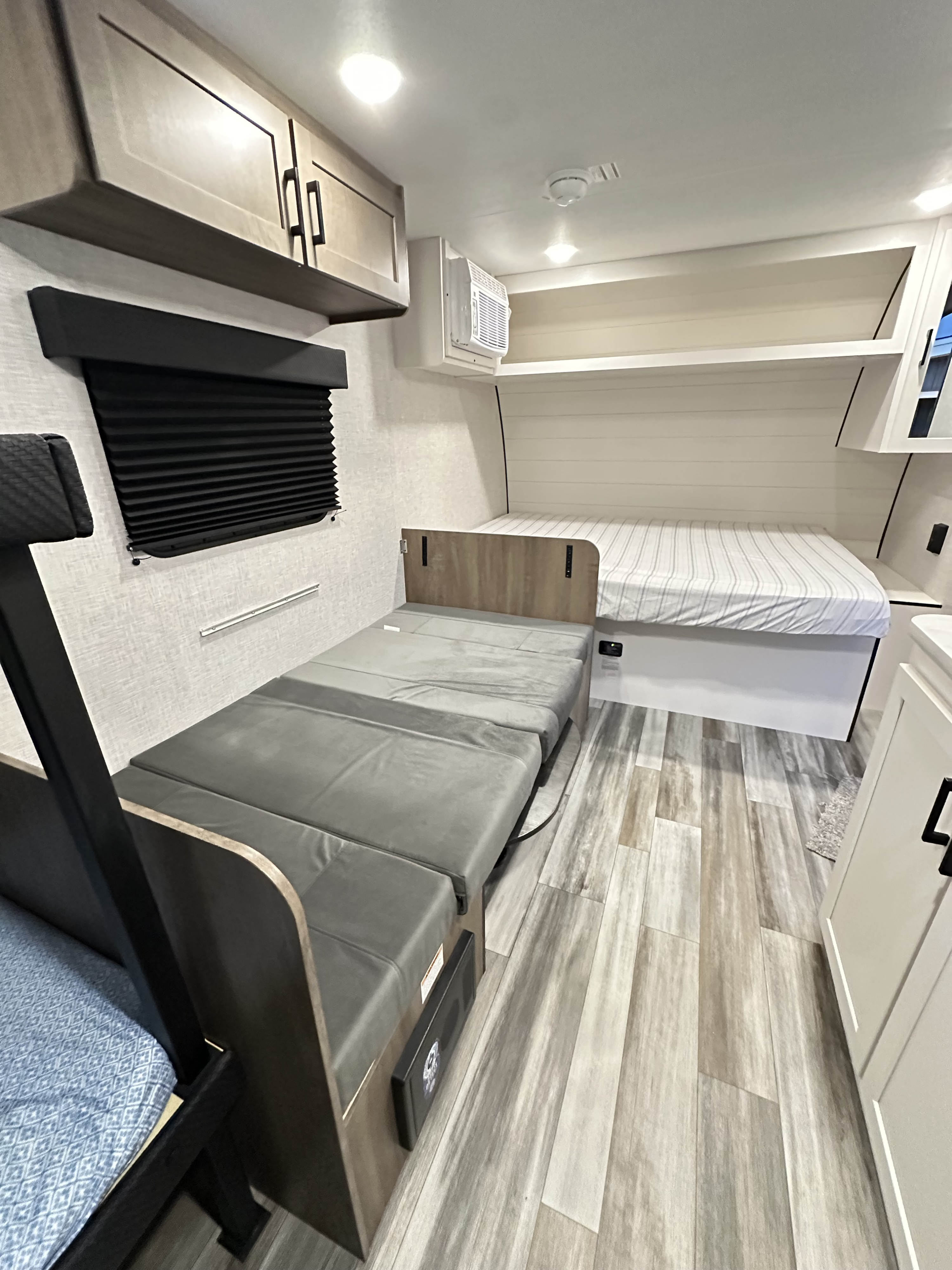 RV rental with versatile sleeping: a fixed bed and convertible sofa/dinette. Includes overhead storage and AC unit.. Jayco Jay Flight SLX Sport Edition 2025