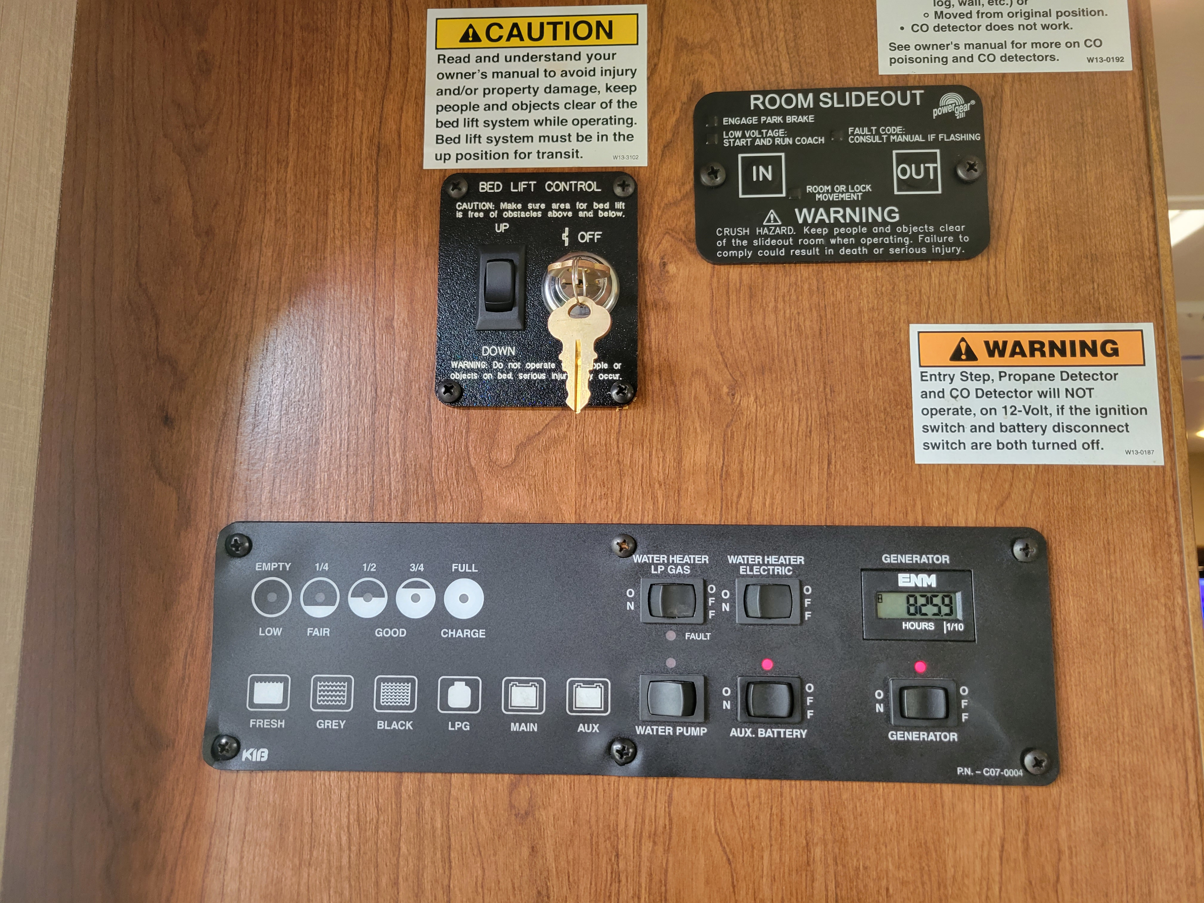 RV rental control panel for managing bed lift, slideout, water, and power systems, including tank and battery gauges.. Flair-Fleetwood Flair-Fleetwood Motorhome 2017