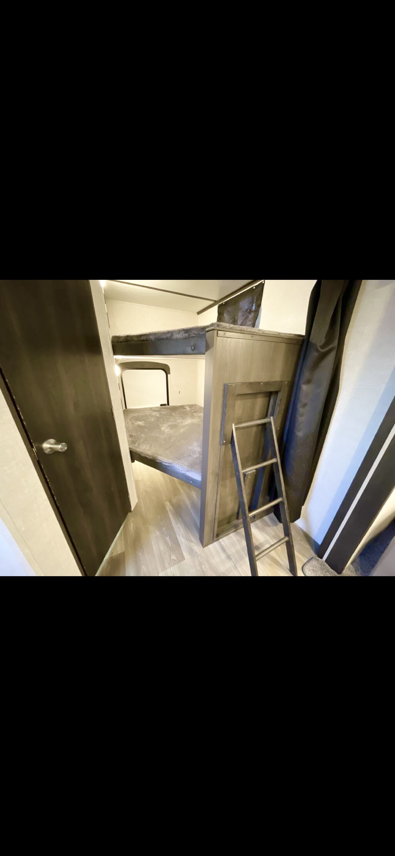 This RV rental features a cozy bunkhouse with sturdy bunks, ladder access, and a lower window for natural light.. Crossroads RV Cruiser aire CR28BBH24 2024