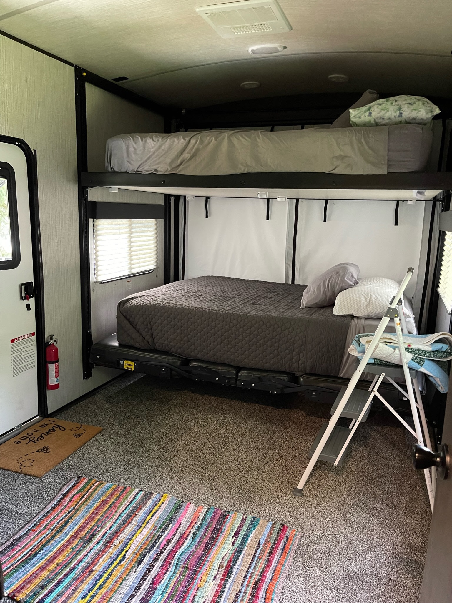 RV rental bunk beds provide a cozy interior sleeping area, complete with a ladder and window, ideal for travel.. Heartland Torque 2021
