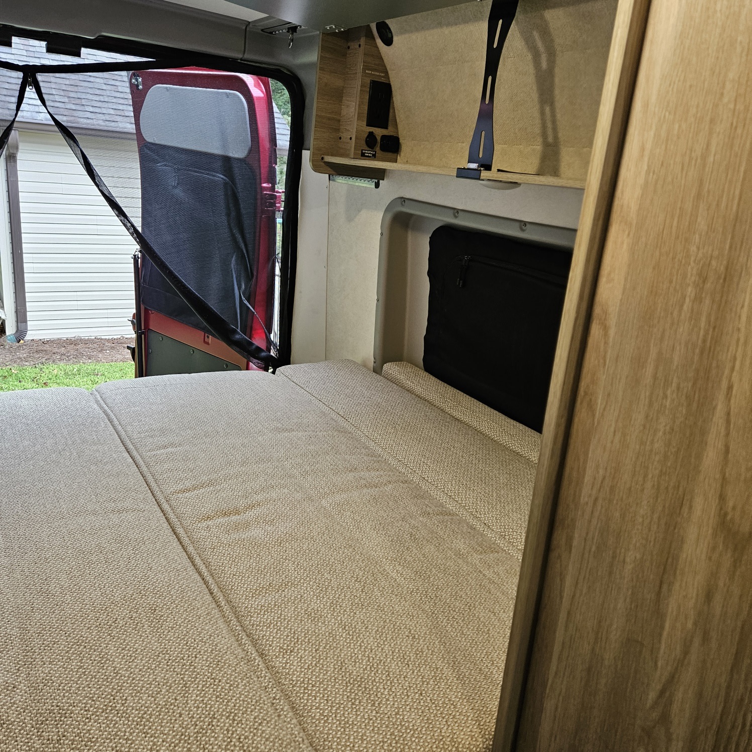 Comfortable RV rental interior with bed, storage, and rear screen for fresh air.. Winnebago Solis 59PX 2022
