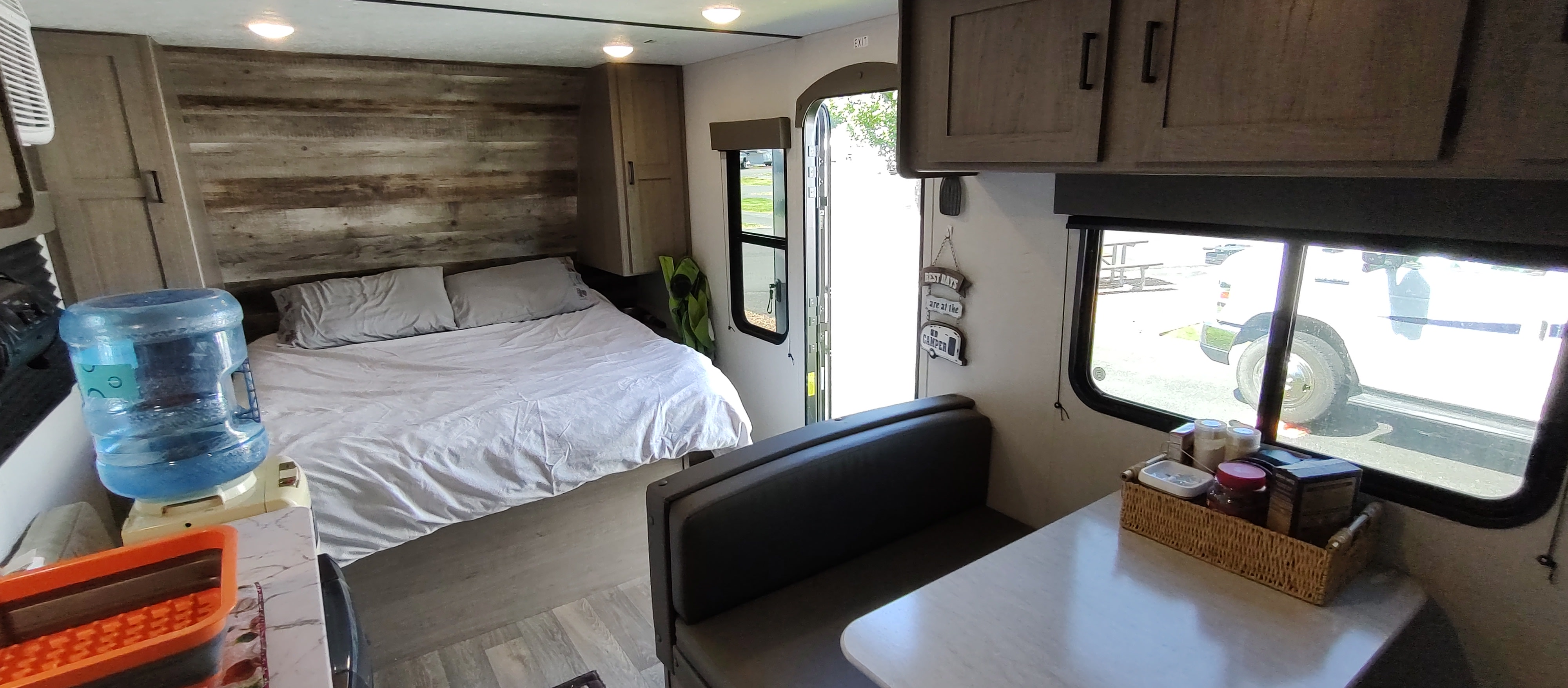 This RV rental offers a cozy bed, handy water dispenser, and dinette area for your comfortable travels.. Keystone RV Hideout 2021